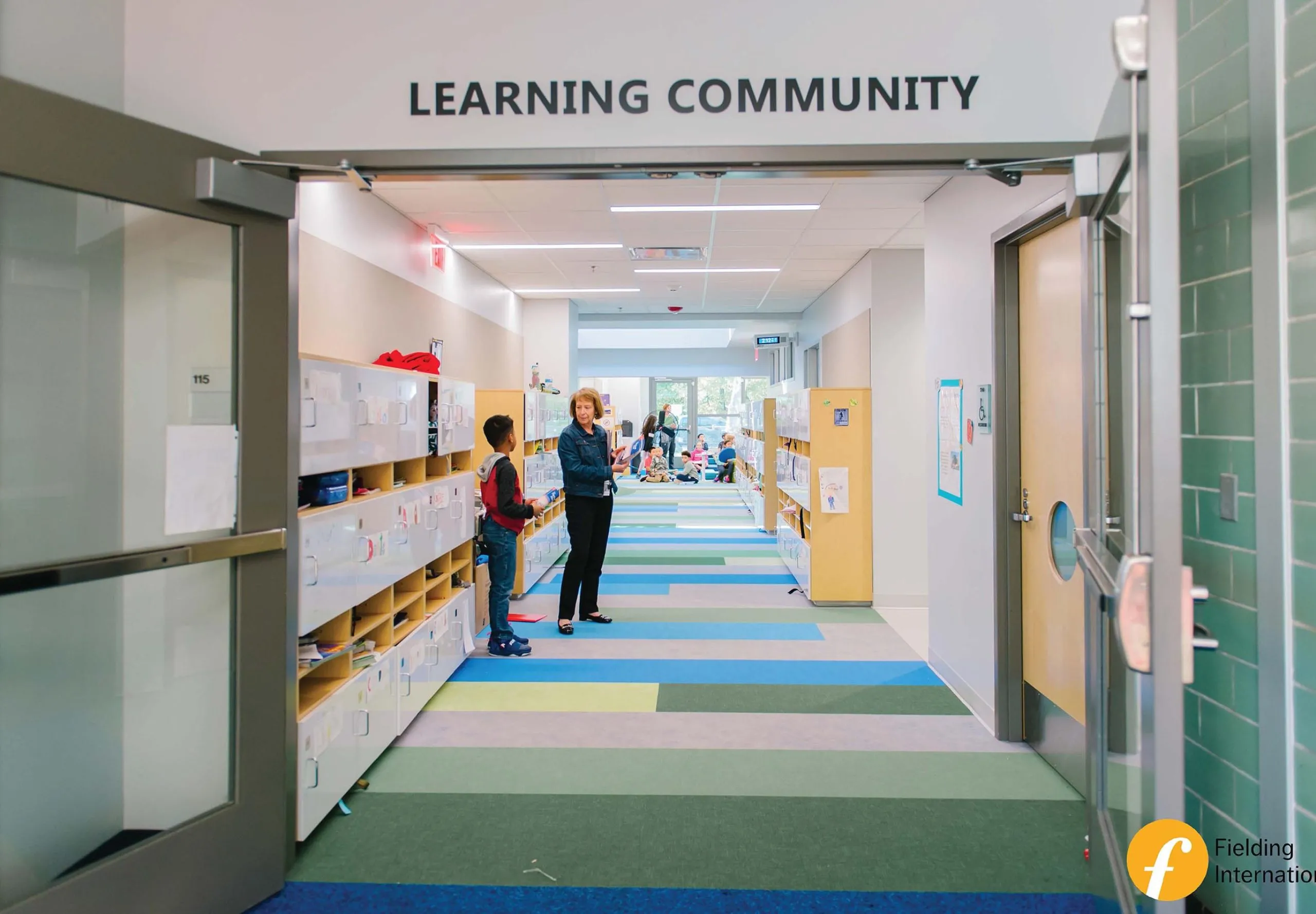 Hallway of Eden Park Elementary School with colorful striped carpeted floors