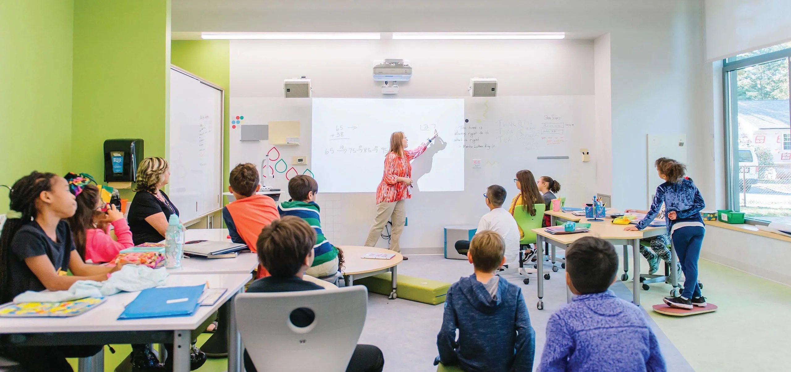 Students looking at white board in classroom at Eden Park Elementary School