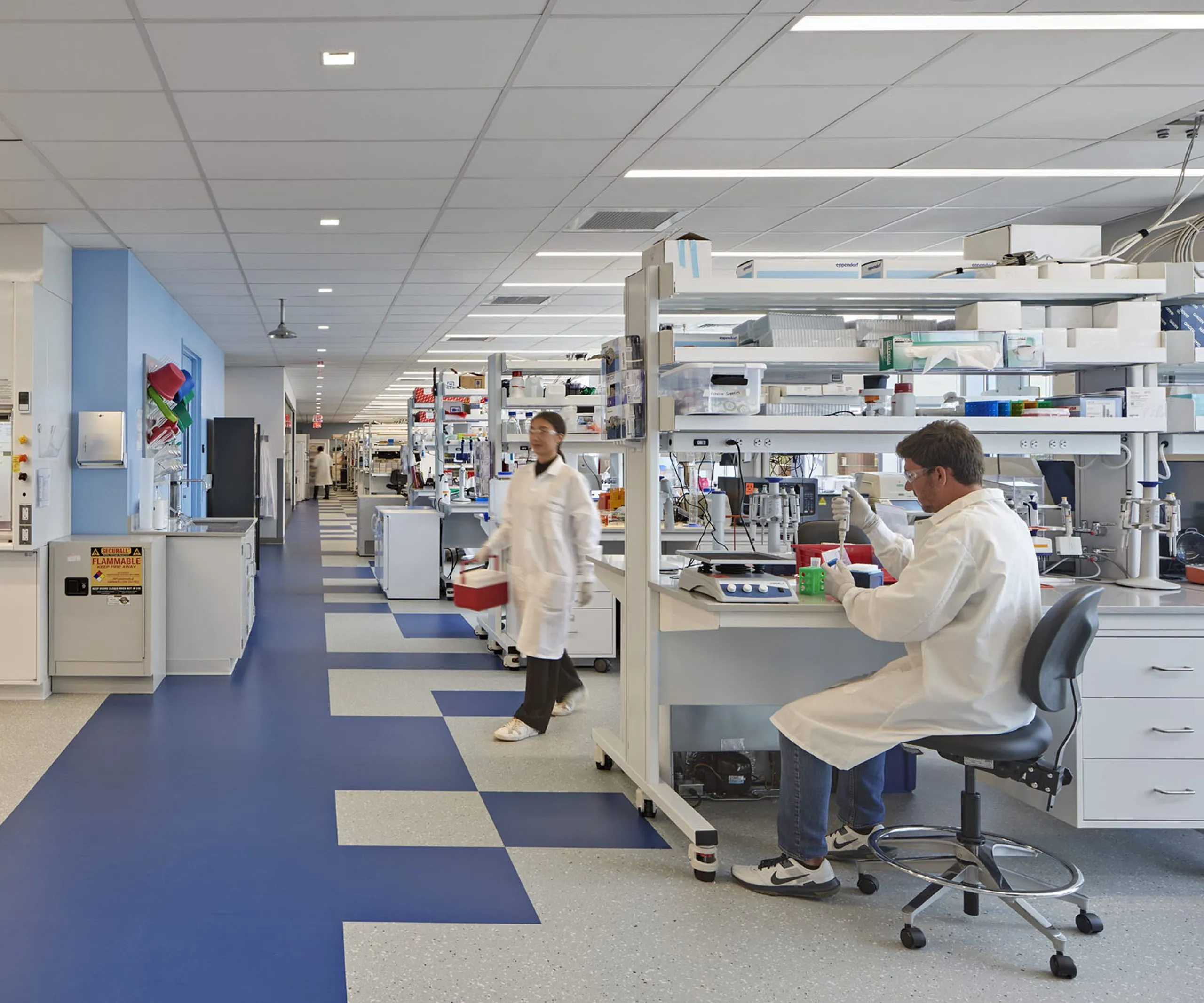 people in lab coats working in a lab