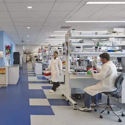 people in lab coats working in a lab