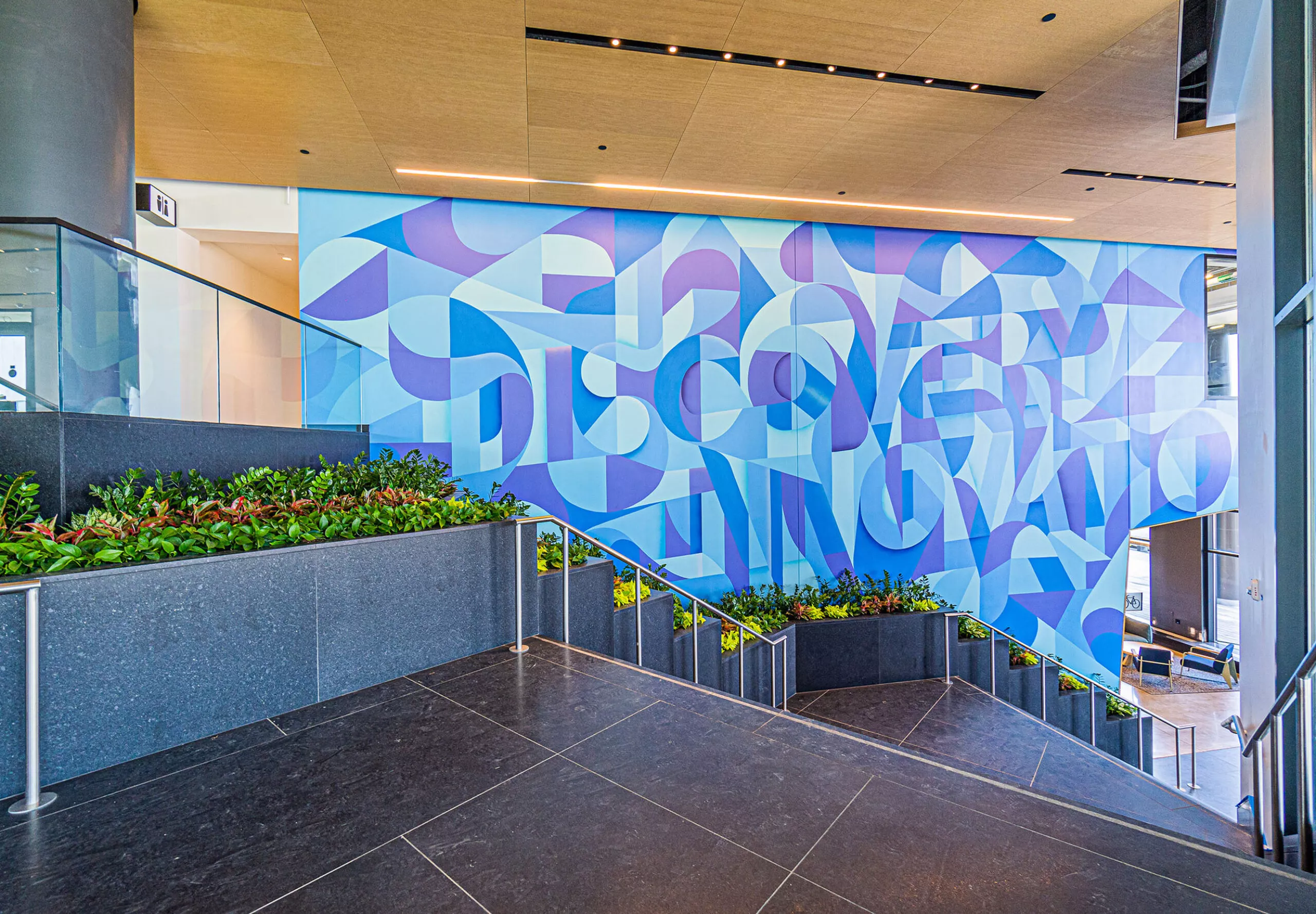 Interior view of the stairway and wall mural at DLJ Real Estate Capital Partners