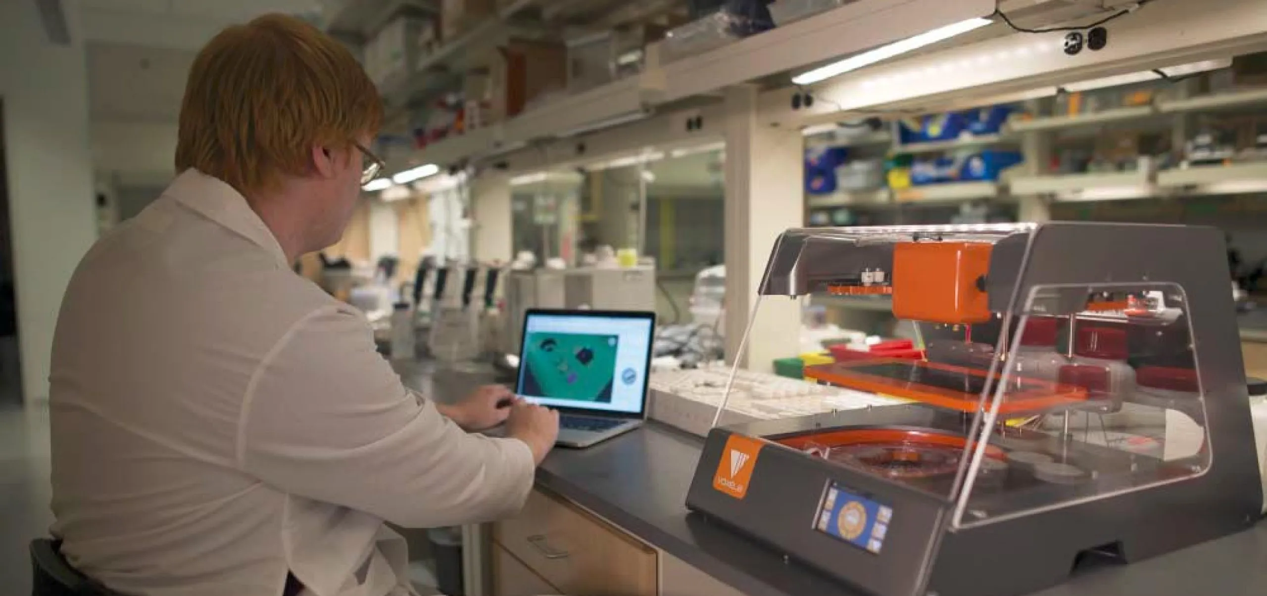 Interior view of a person in a lab coat working in the lab