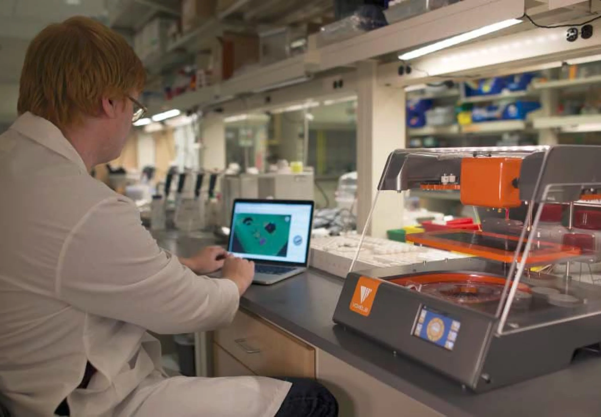 Interior view of a person in a lab coat working in the lab