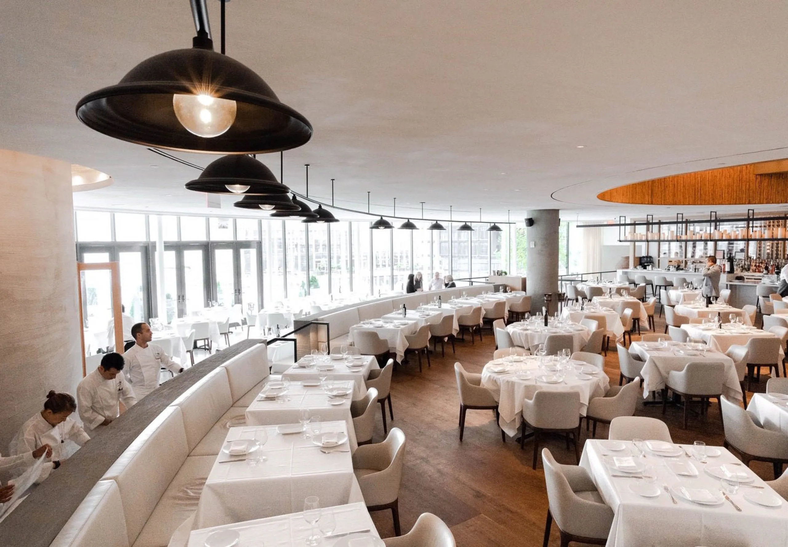 Interior view of the dining room and kitchen at Estiatorio Milos