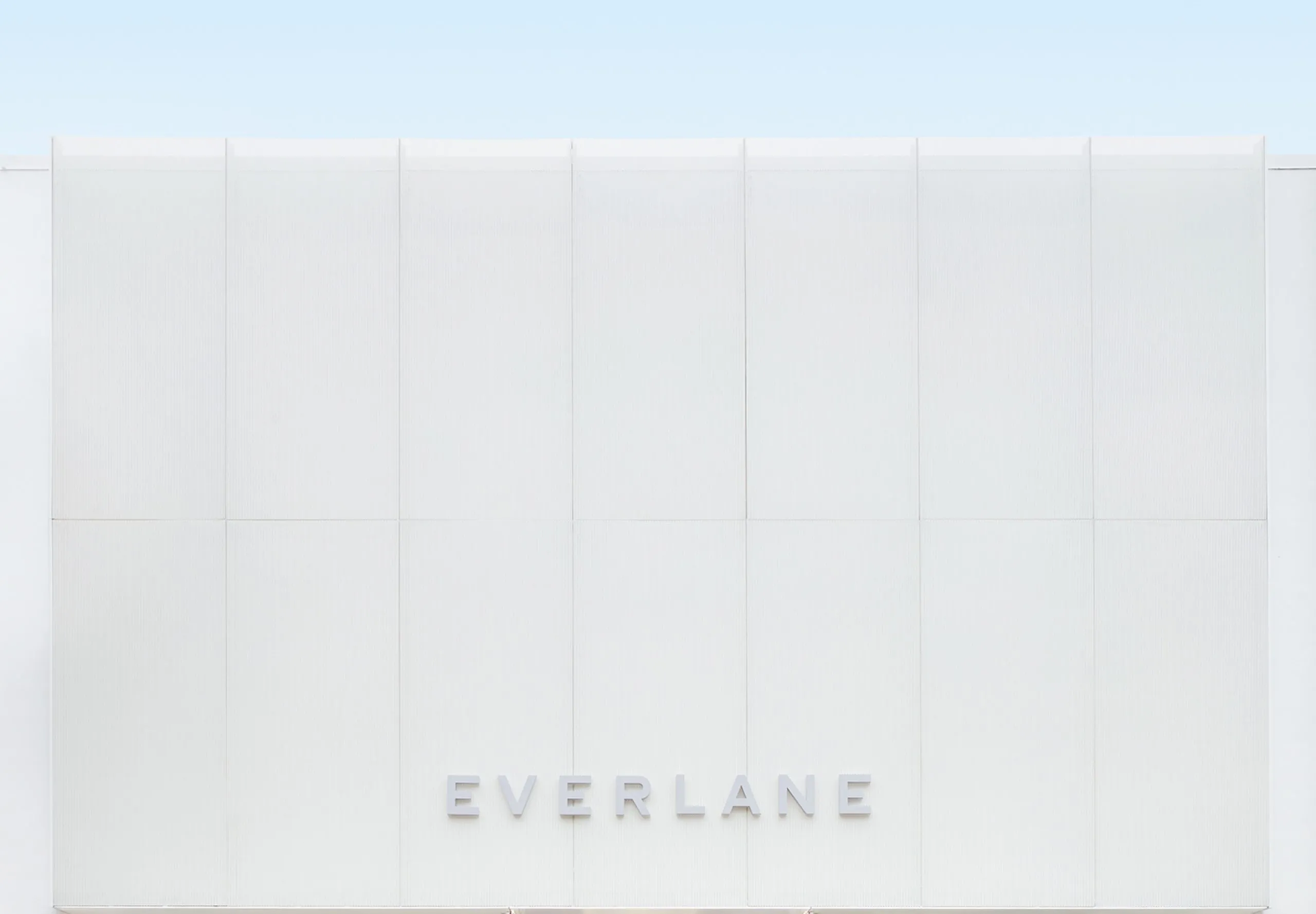 Exterior all white entryway to Everlane