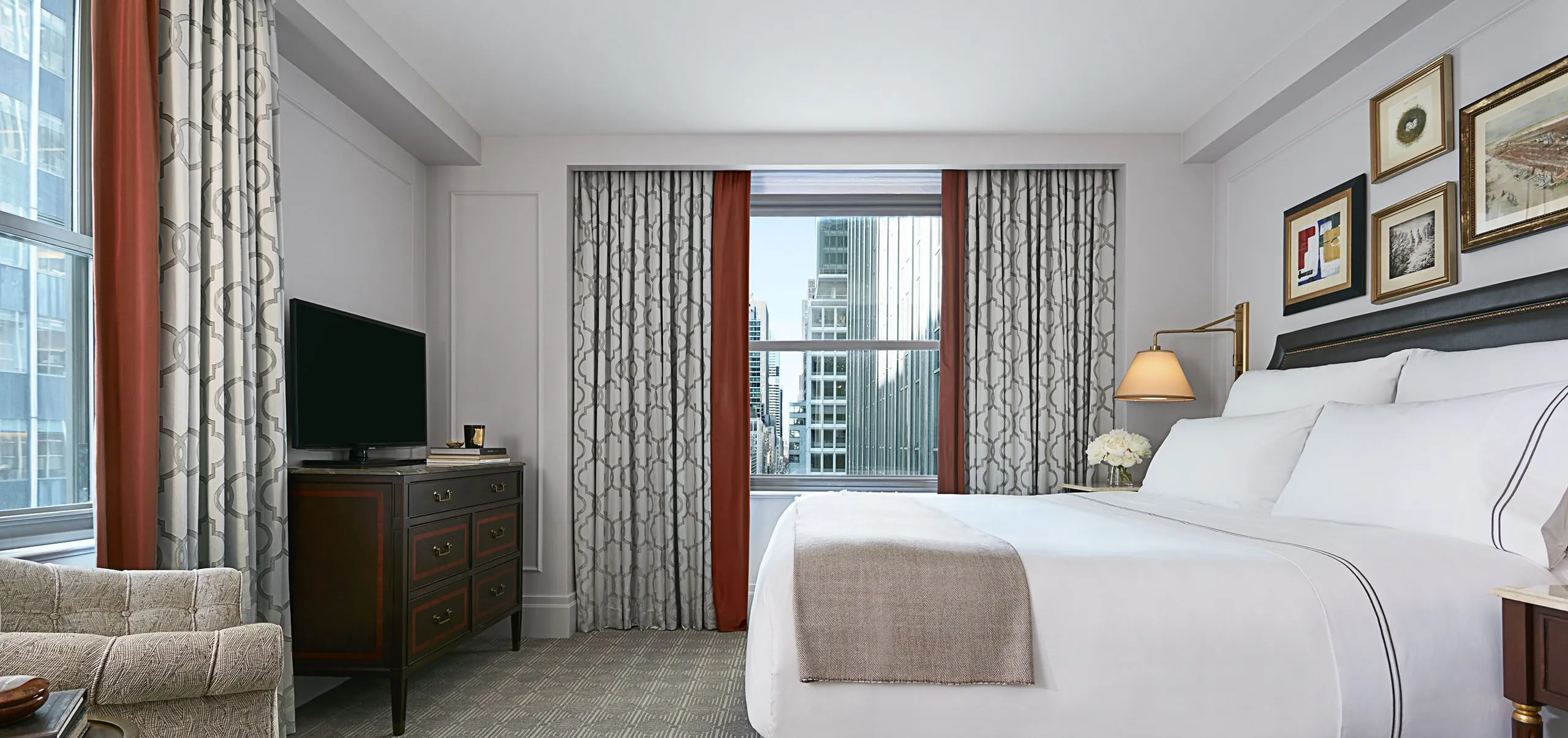 Interior view of a hotel room with a bed at InterContinental New York Barclay