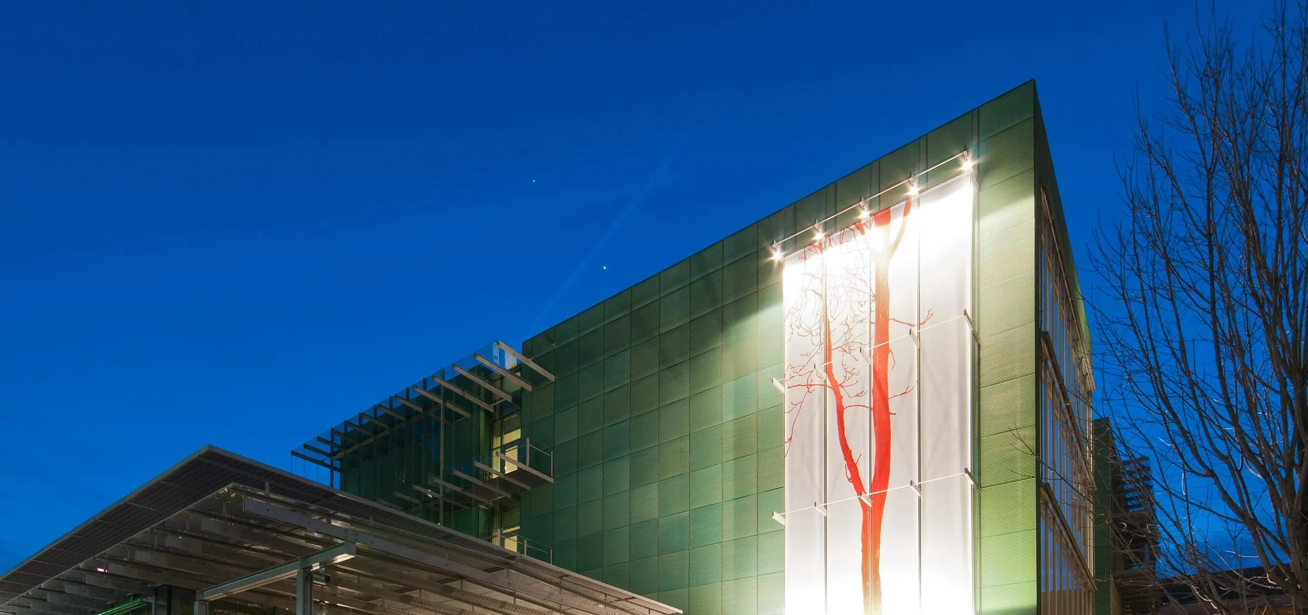 Exterior of Isabella Stewart Gardner Museum with large artwork on the walls