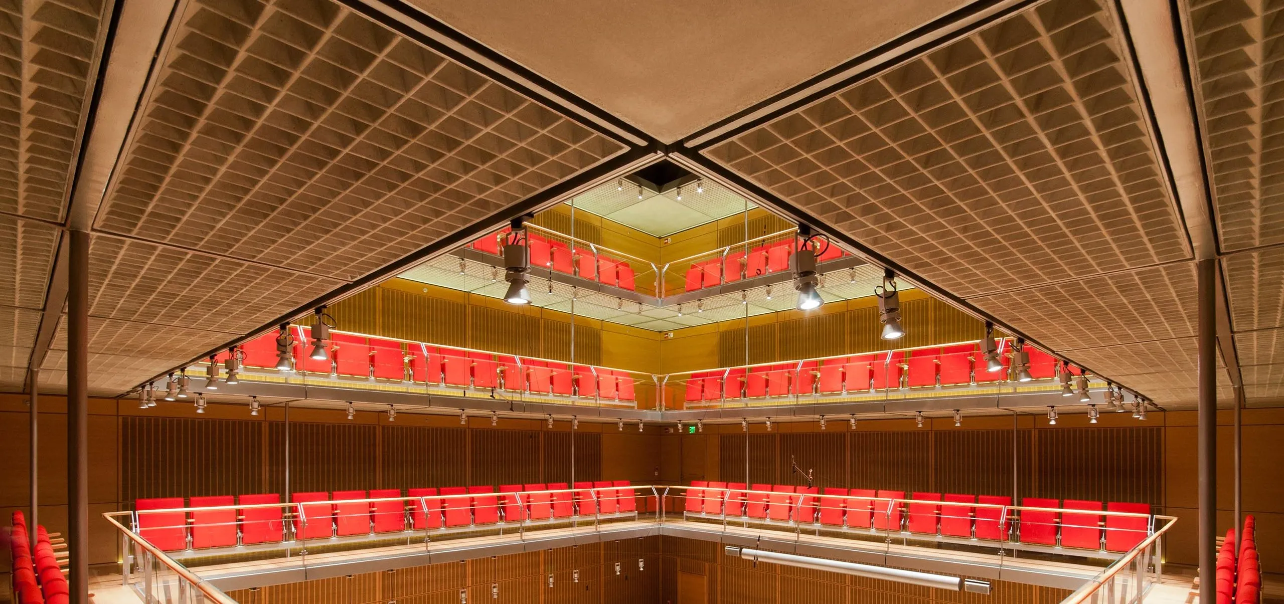 Vertical auditorium surrounding piano in center of room at Isabella Stewart Gardner Museum