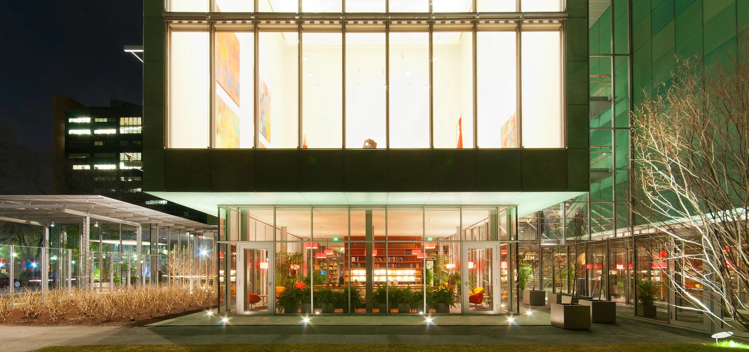 Exterior of first and second floor of Isabella Stewart Gardner Museum with art visible in windows