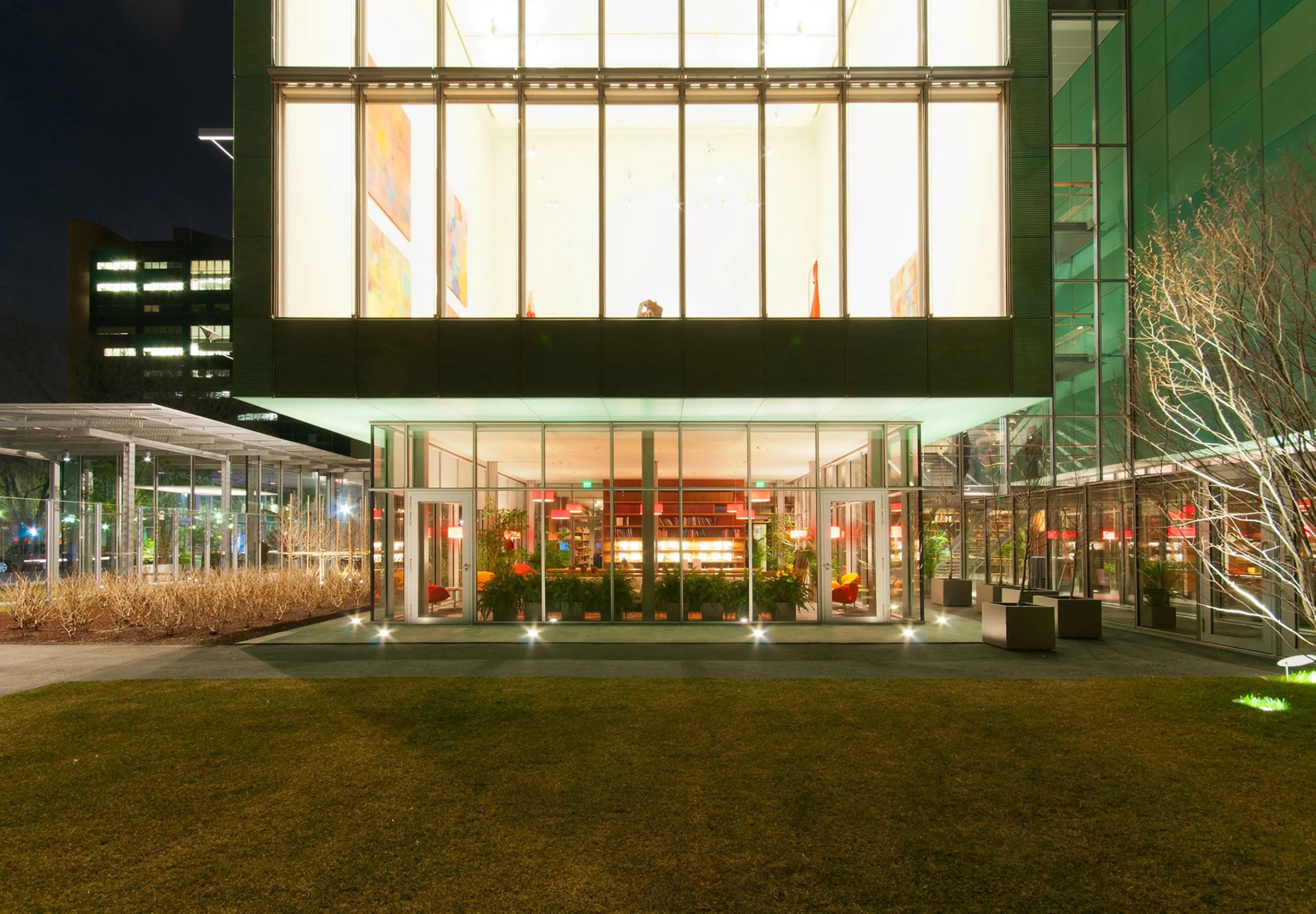 Exterior of first and second floor of Isabella Stewart Gardner Museum with art visible in windows