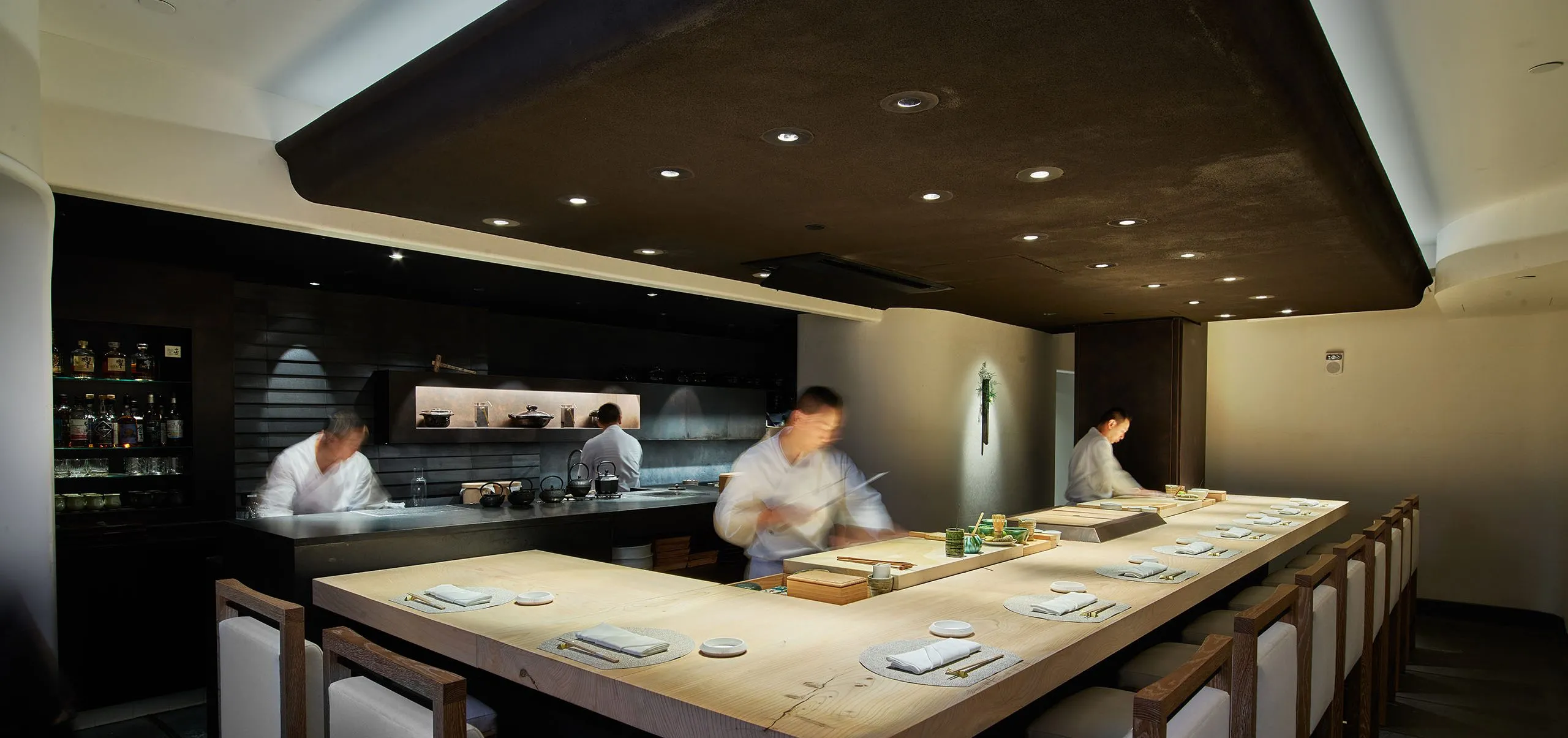 Interior view of the dining room and kitchen at Joji