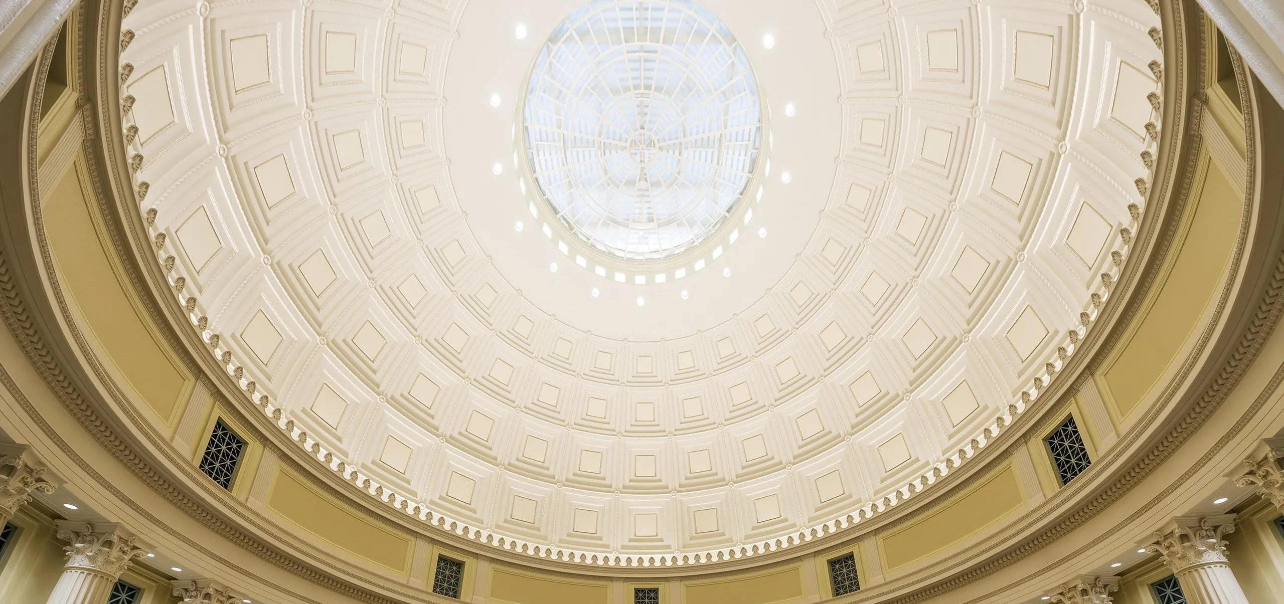 a room with chairs and tables in a large domed ceiling