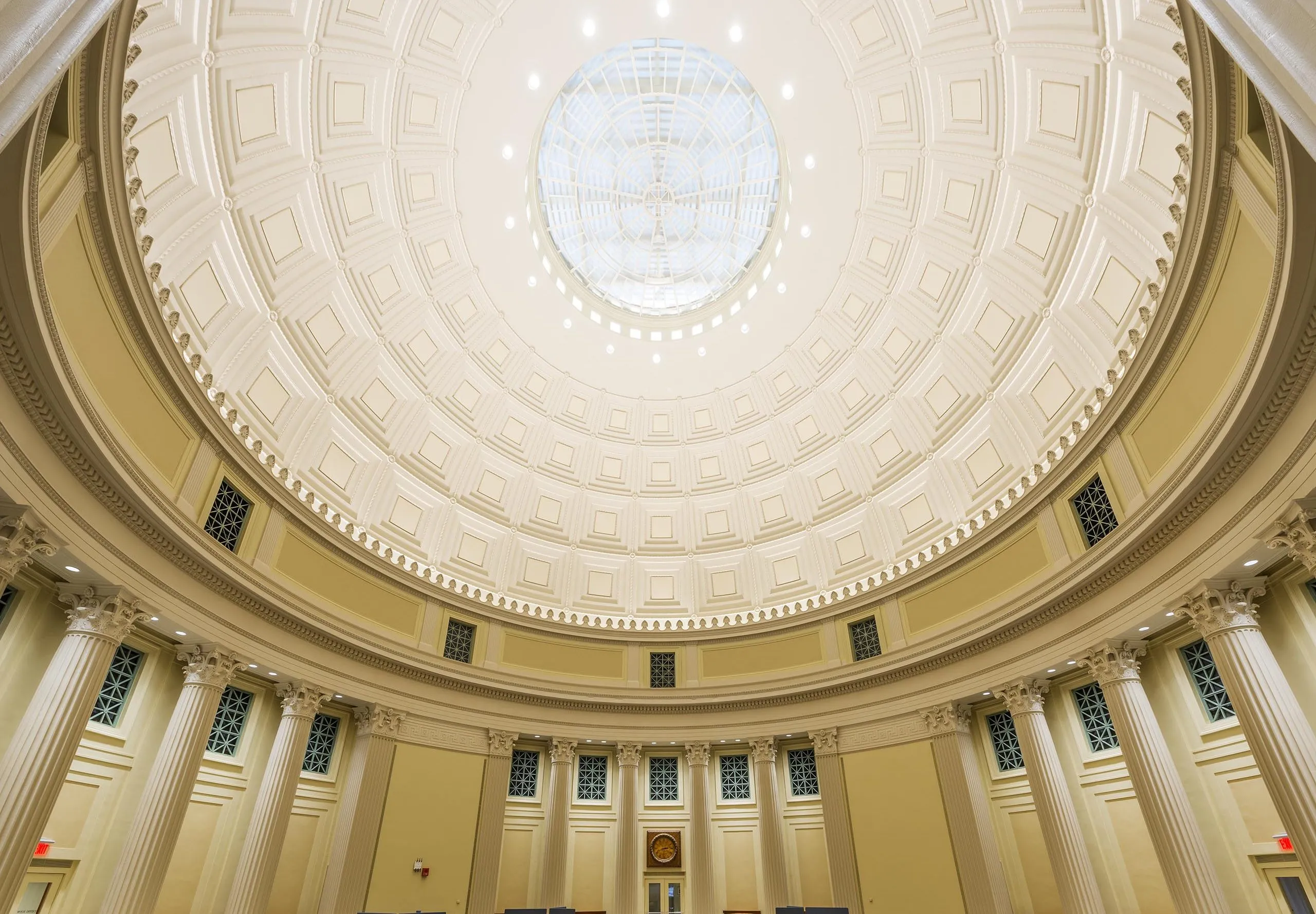 a room with chairs and tables in a large domed ceiling