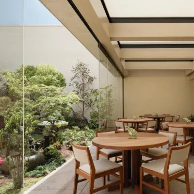 Interior view of Nobu Palo Alto Garden Restaurant dining tables and garden