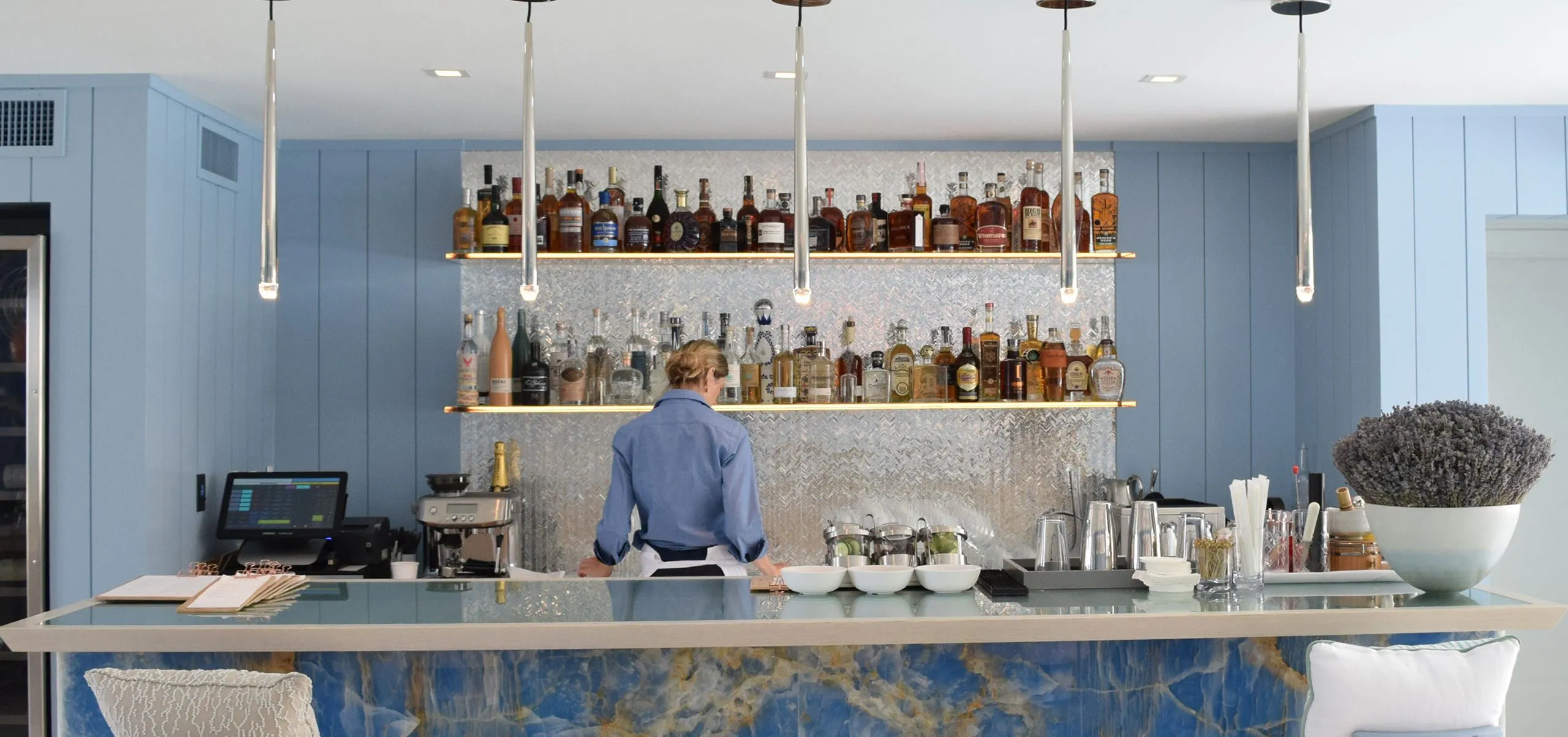 Interior view of the bar and female bartender and the Oceana