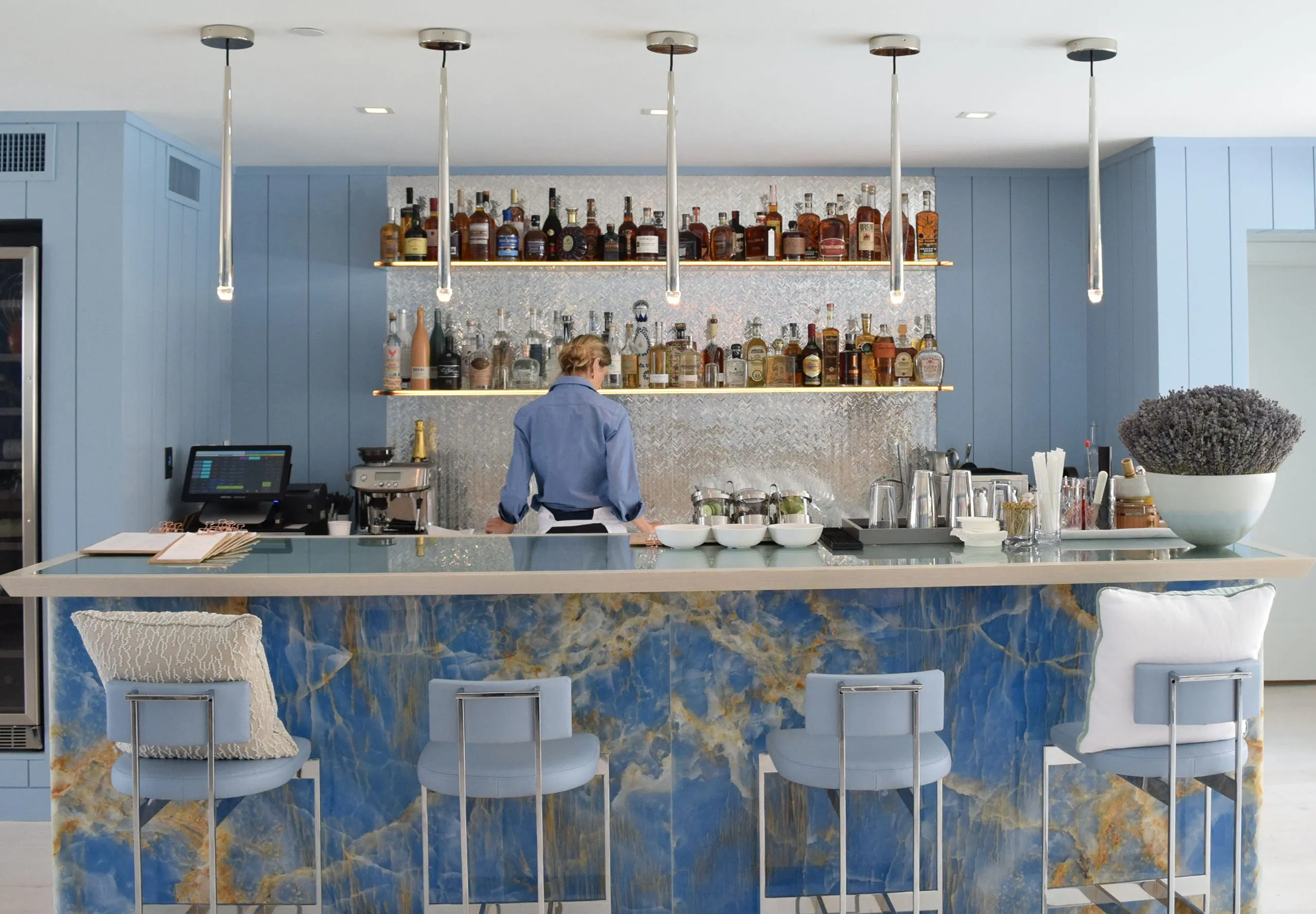 Interior view of the bar and female bartender and the Oceana