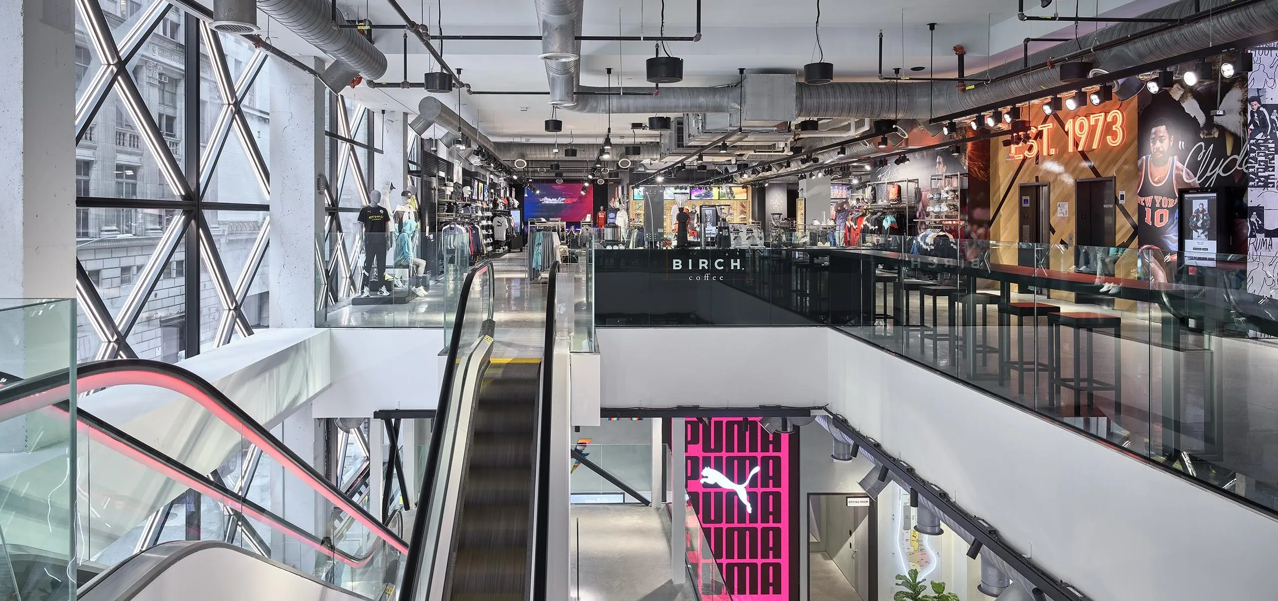 Interior of PUMA store with escalator