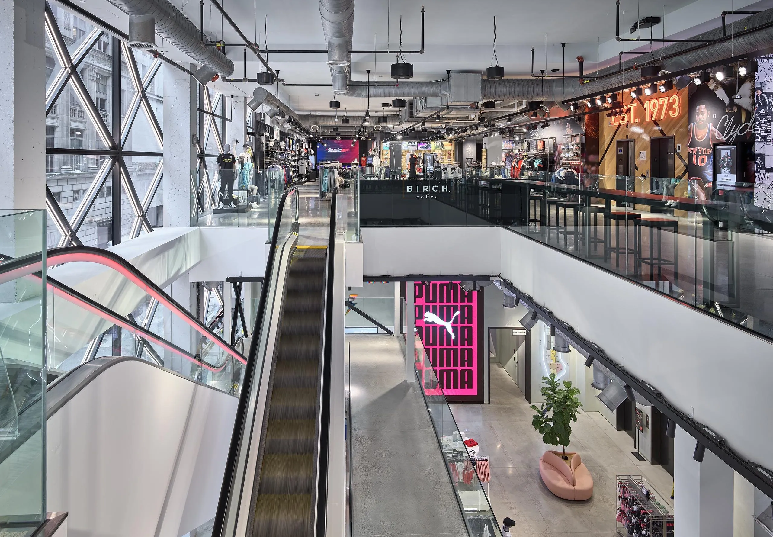 Interior of PUMA store with escalator