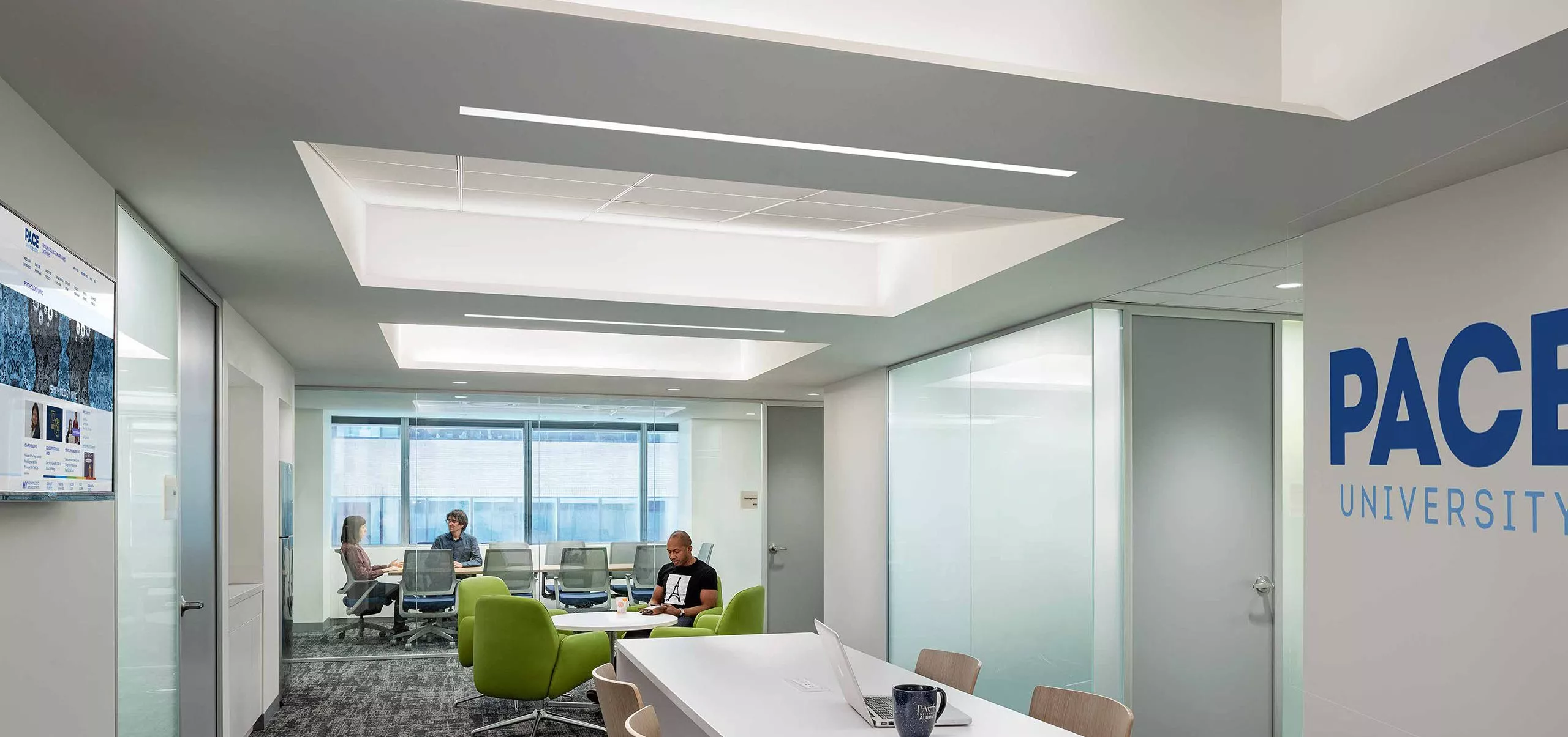 Work area and meeting room inside Pace University McShane Center