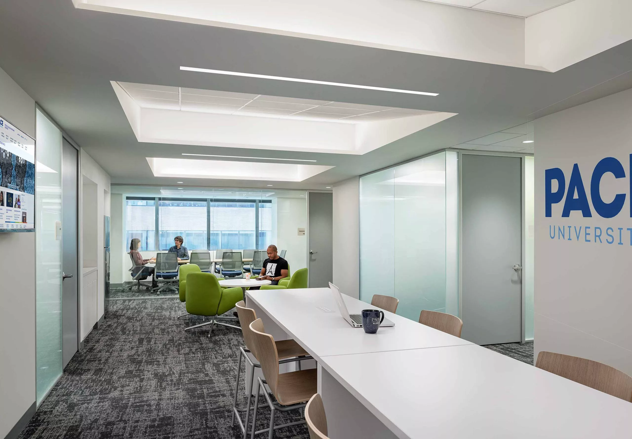 Work area and meeting room inside Pace University McShane Center