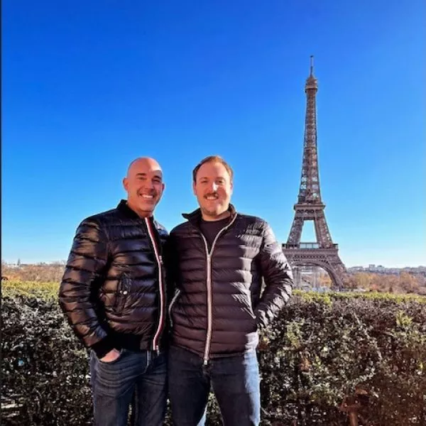 Doug Lareau with a man at the Eiffel Tower