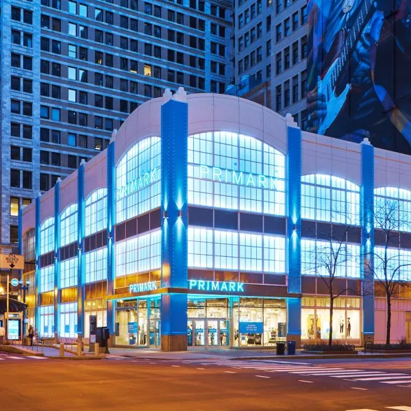 Brightly lit exterior of Primark building