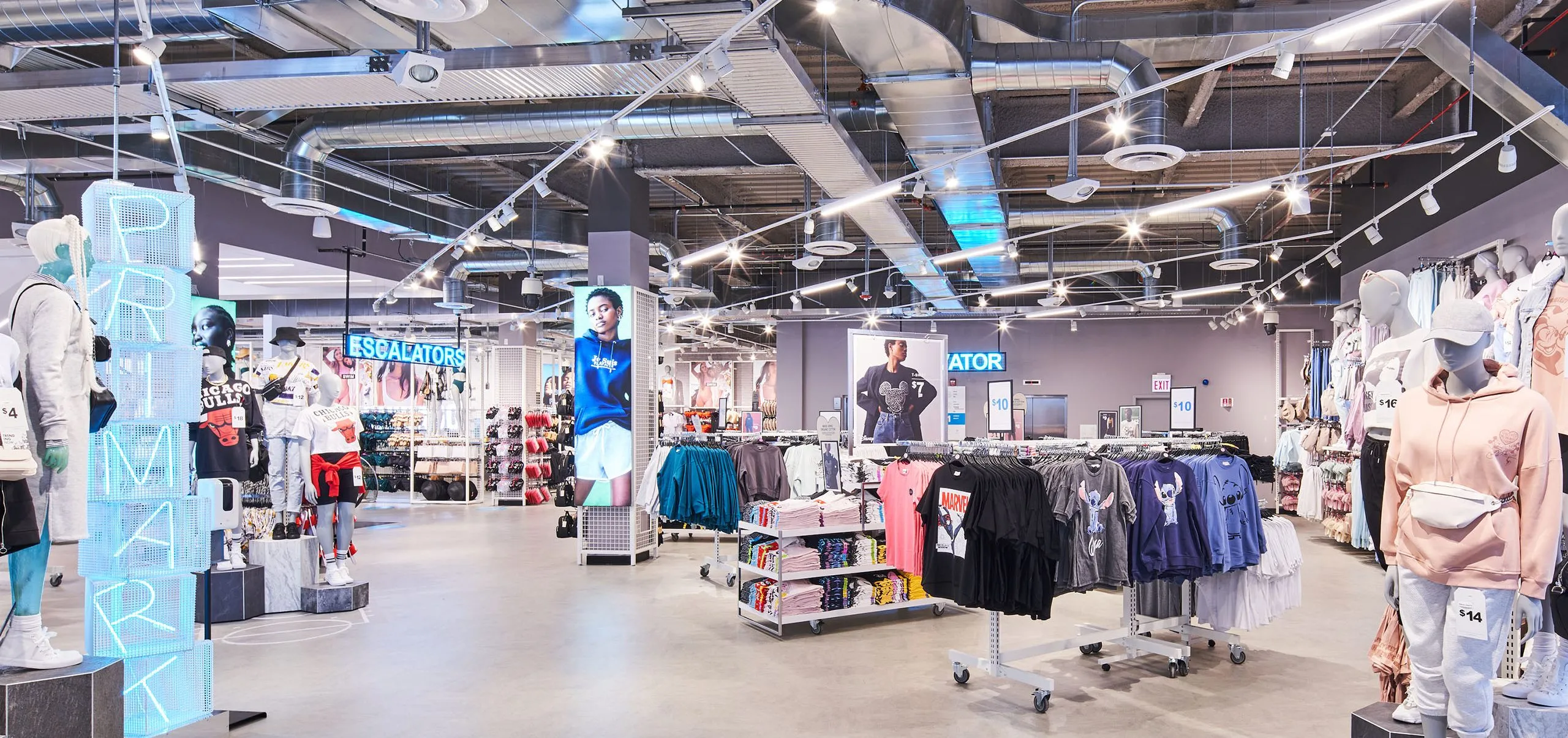 Interior with clothes racks and mannequins in Primark