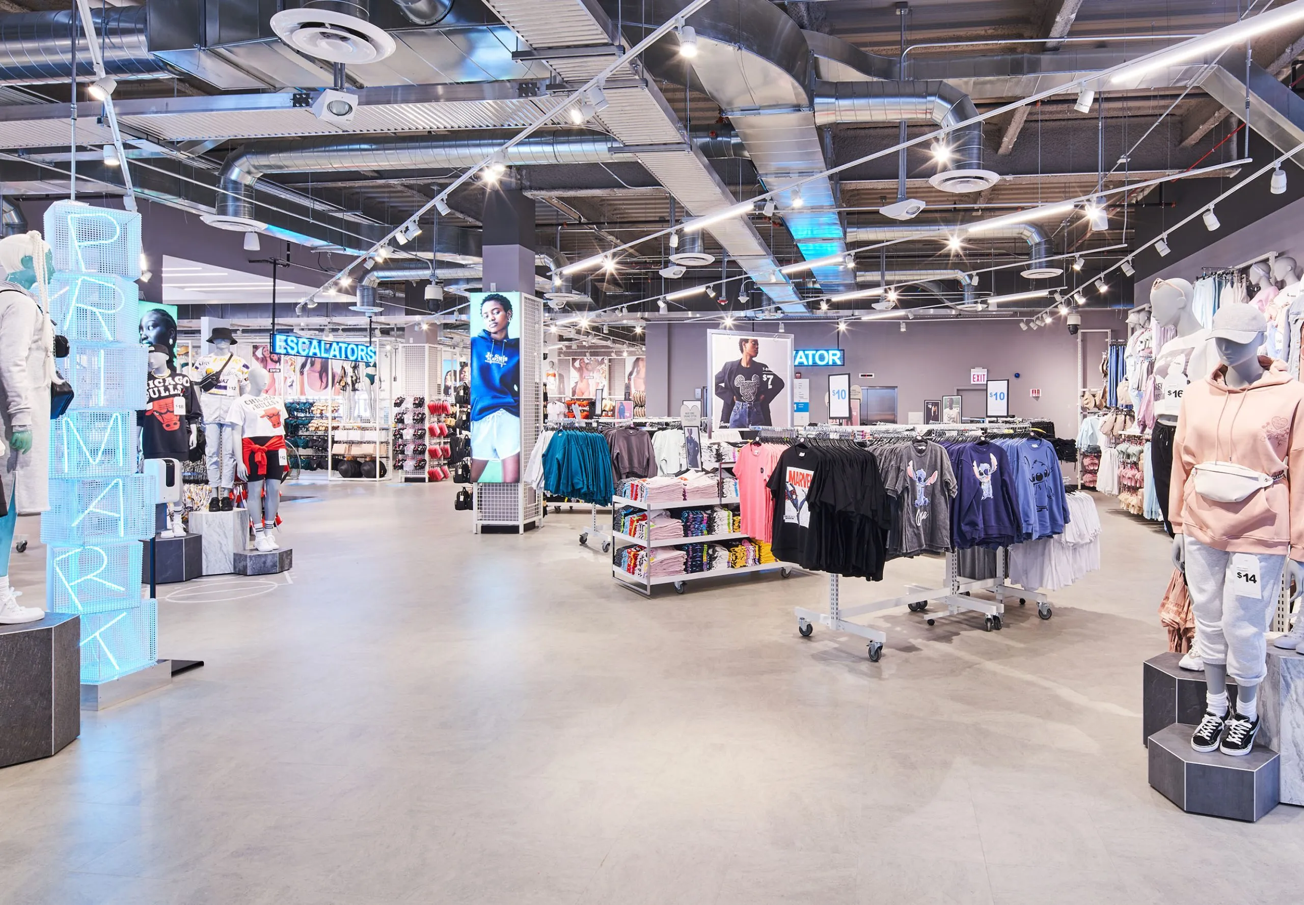 Interior with clothes racks and mannequins in Primark