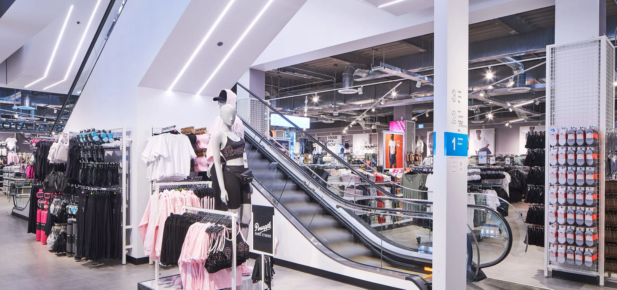 Interior with clothes racks and mannequins in Primark