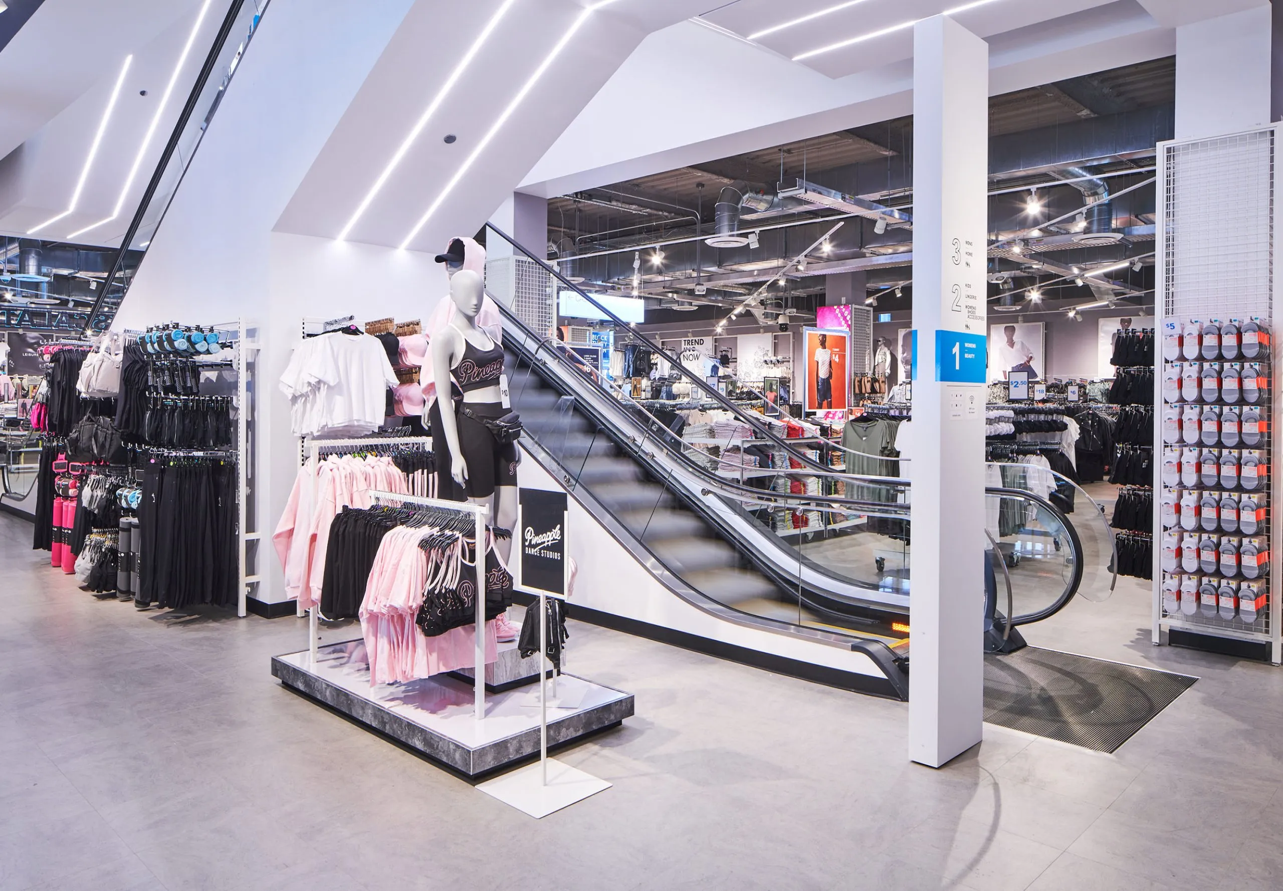 Interior with clothes racks and mannequins in Primark