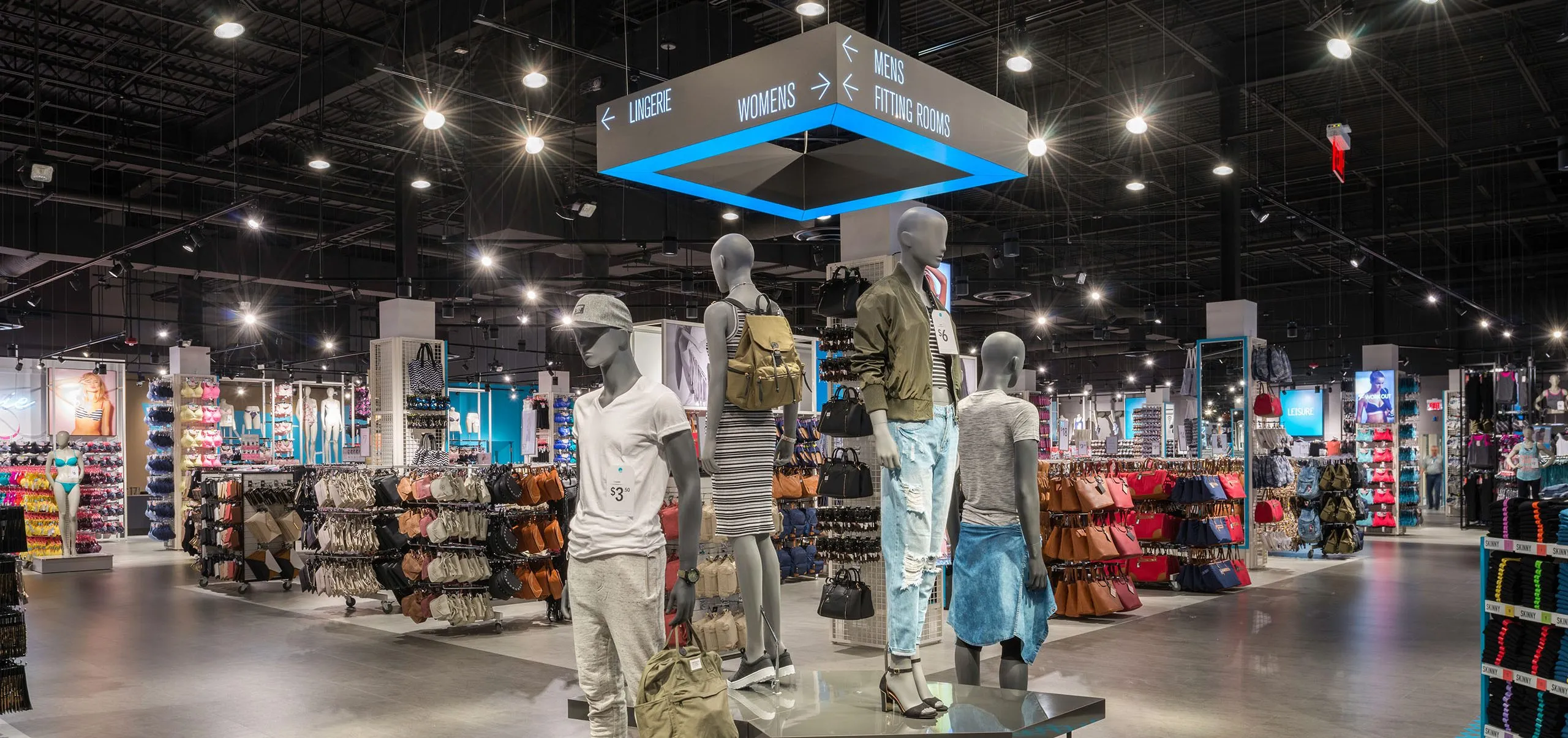 Interior with clothes racks and mannequins in Primark