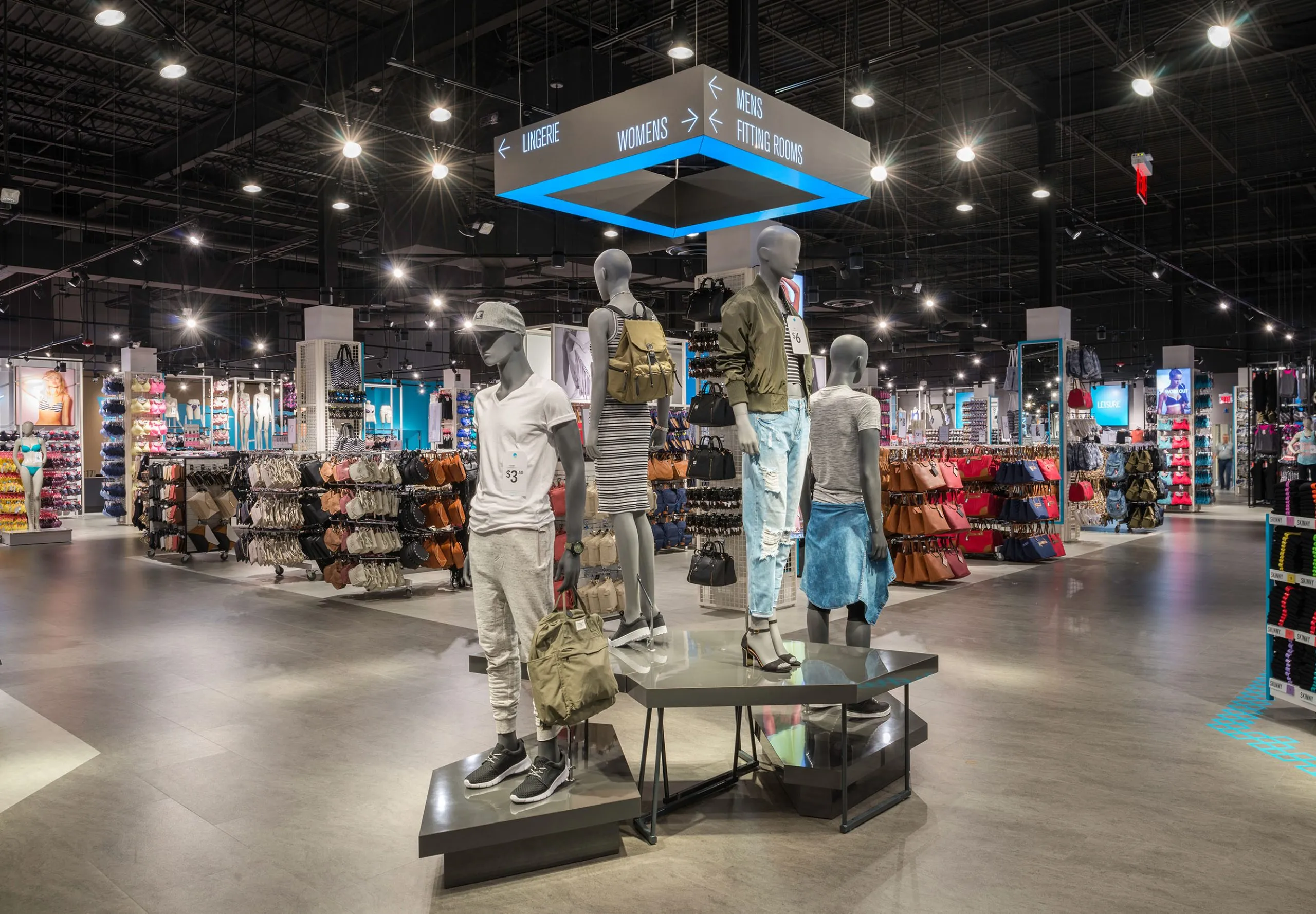 Interior with clothes racks and mannequins in Primark