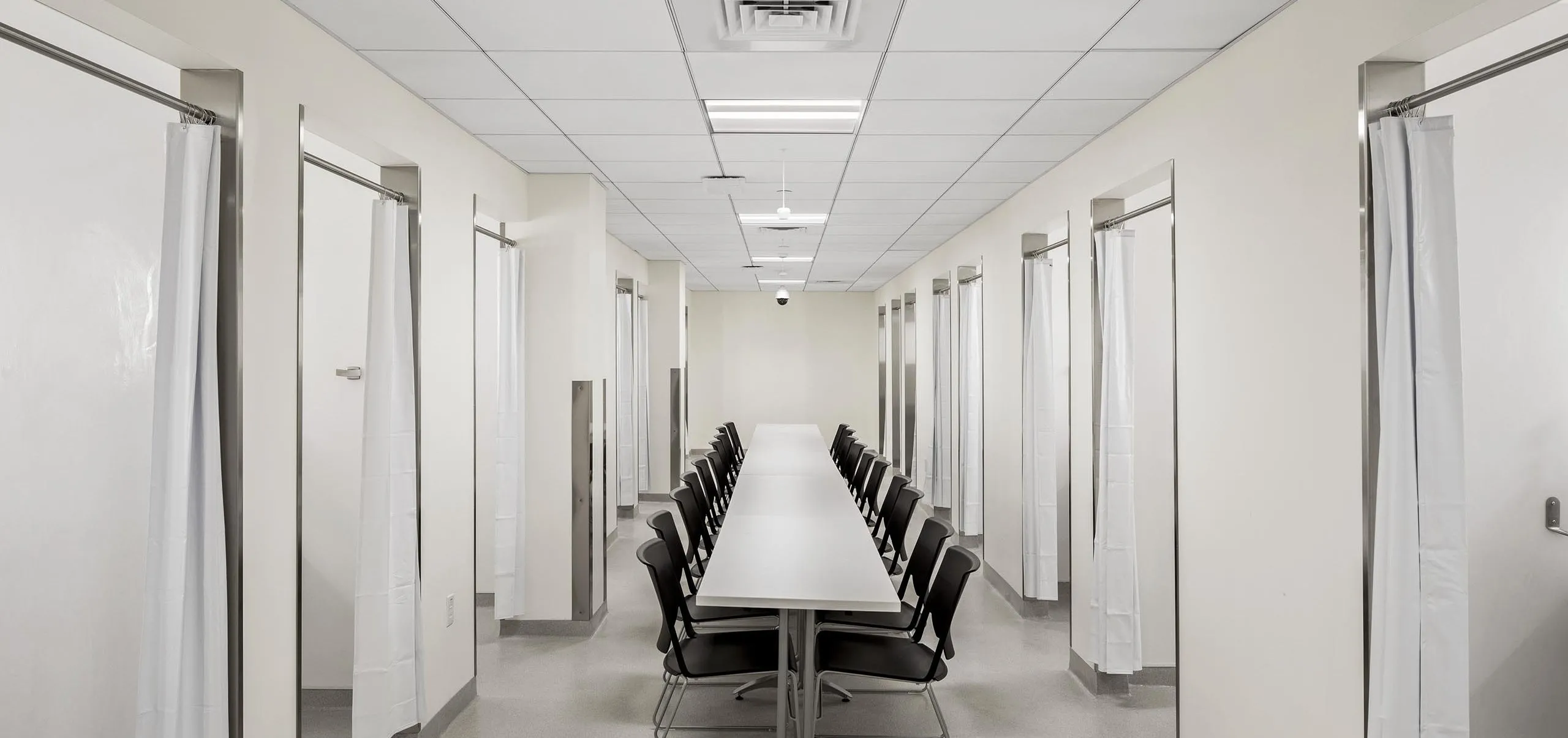 long room with table and chairs running down the center