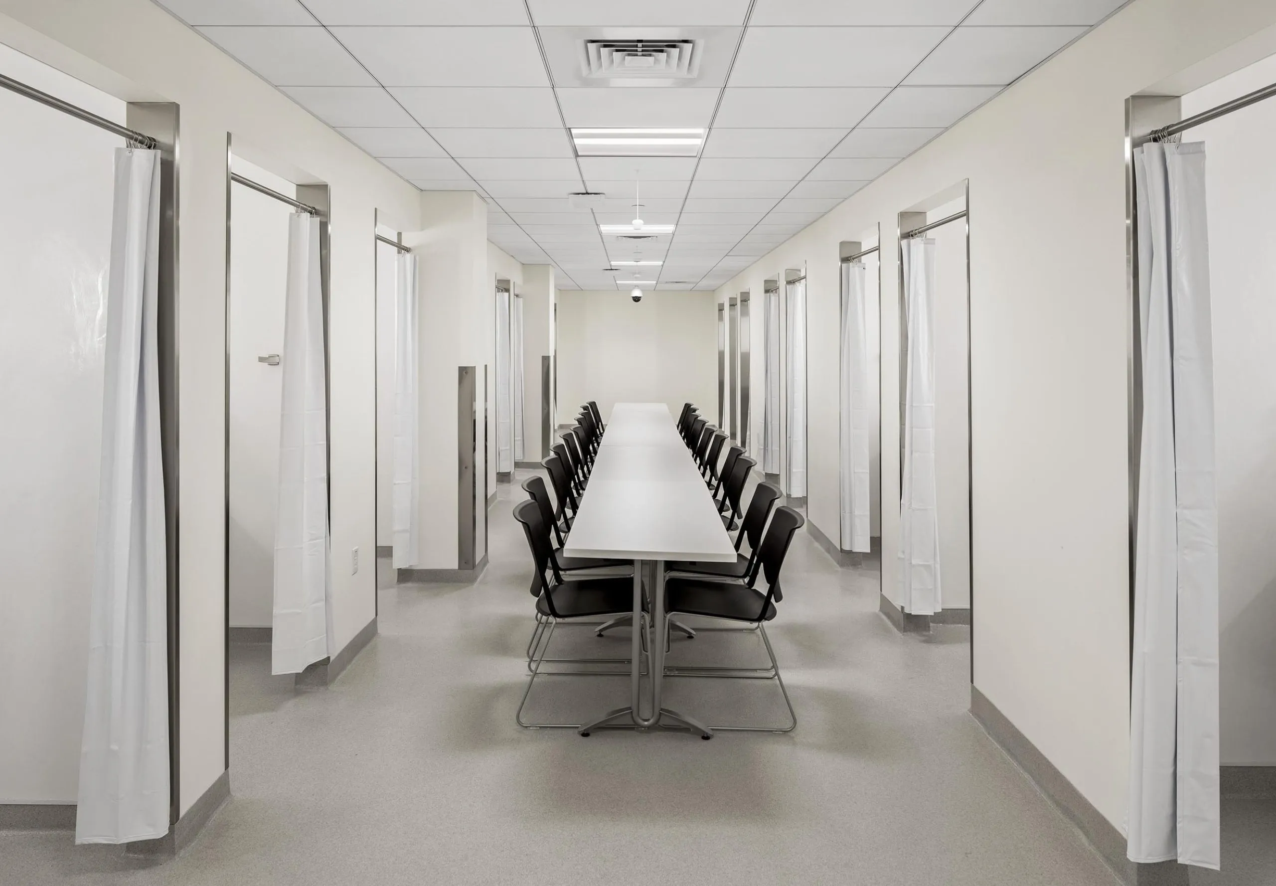 long room with table and chairs running down the center