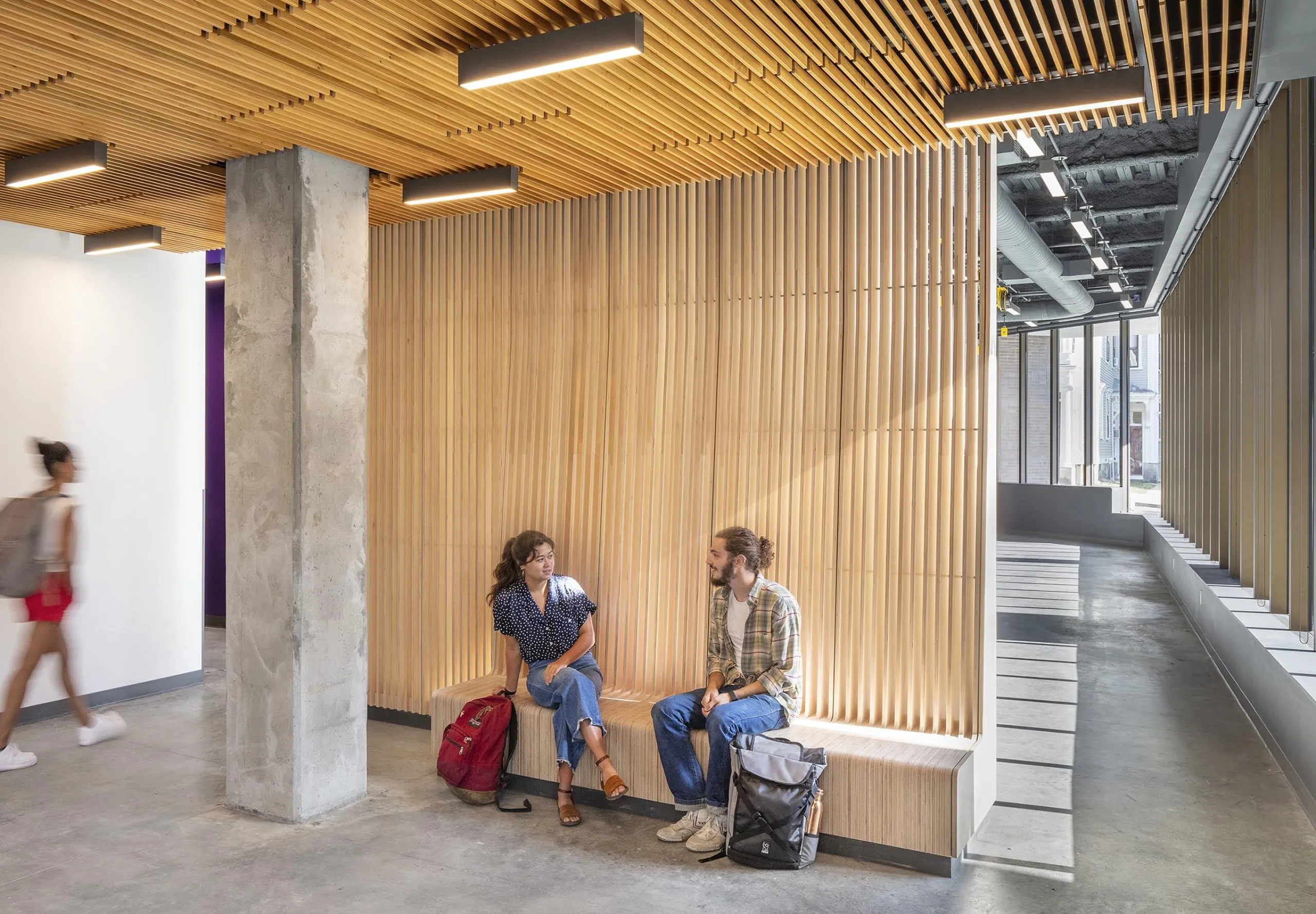 Indoor image of people talking at RISD Quad Block