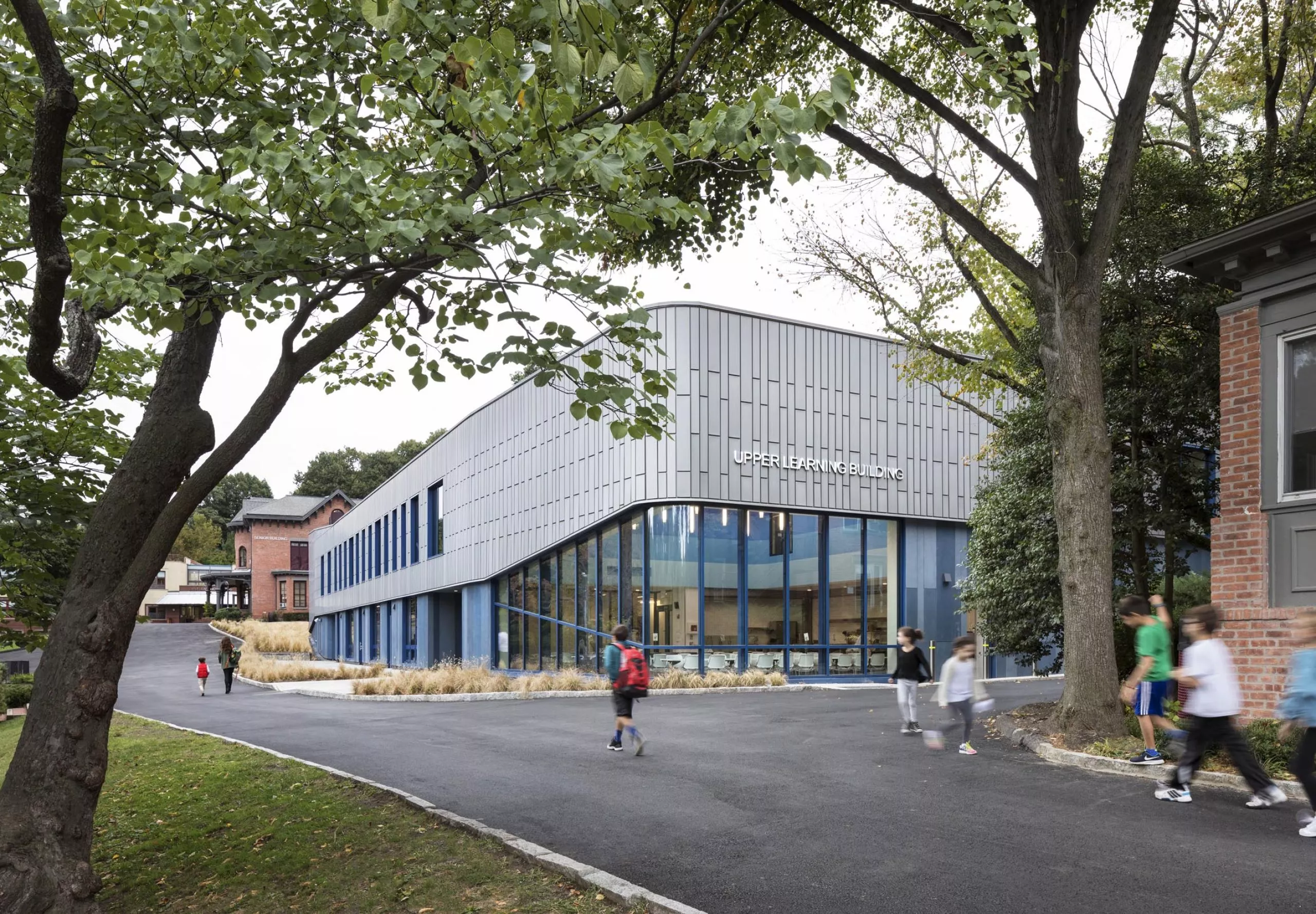 Students walking on pathway outside Riverdale Country School Upper Learning Building