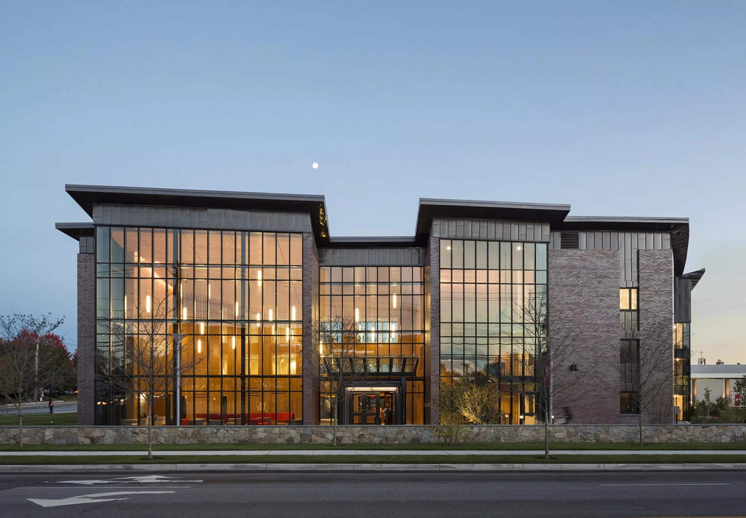 exterior view of Sacred Heart University Jorge Bergoglio Hall at dusk