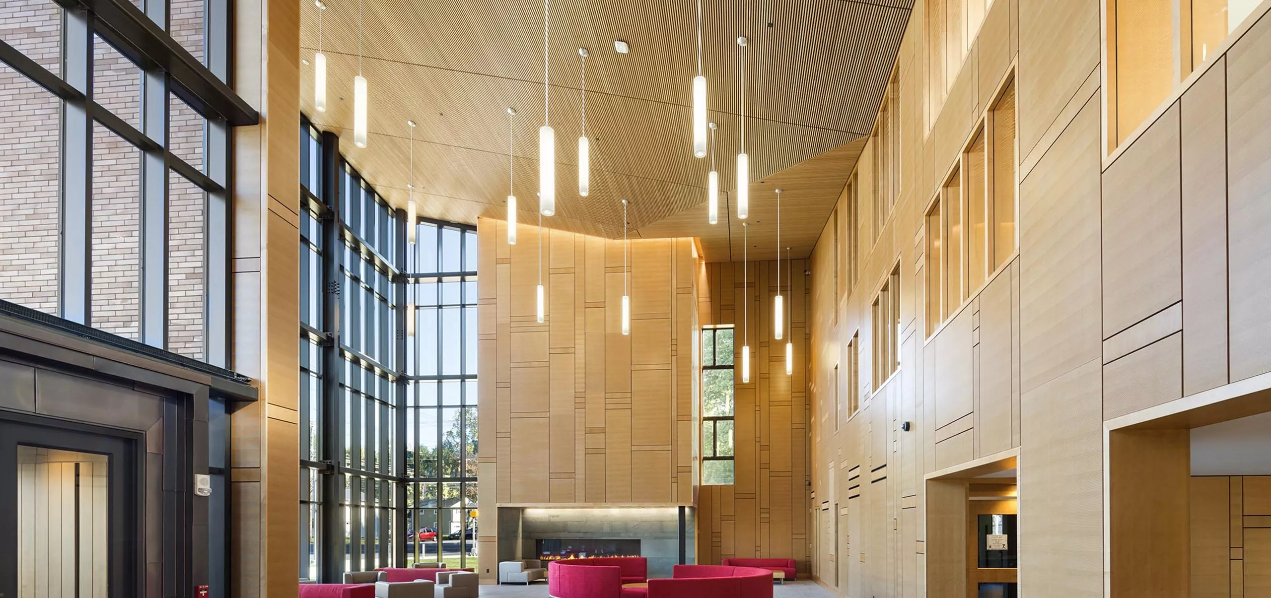 interior view of common area with couches and chairs at Sacred Heart University Jorge Bergoglio Hall