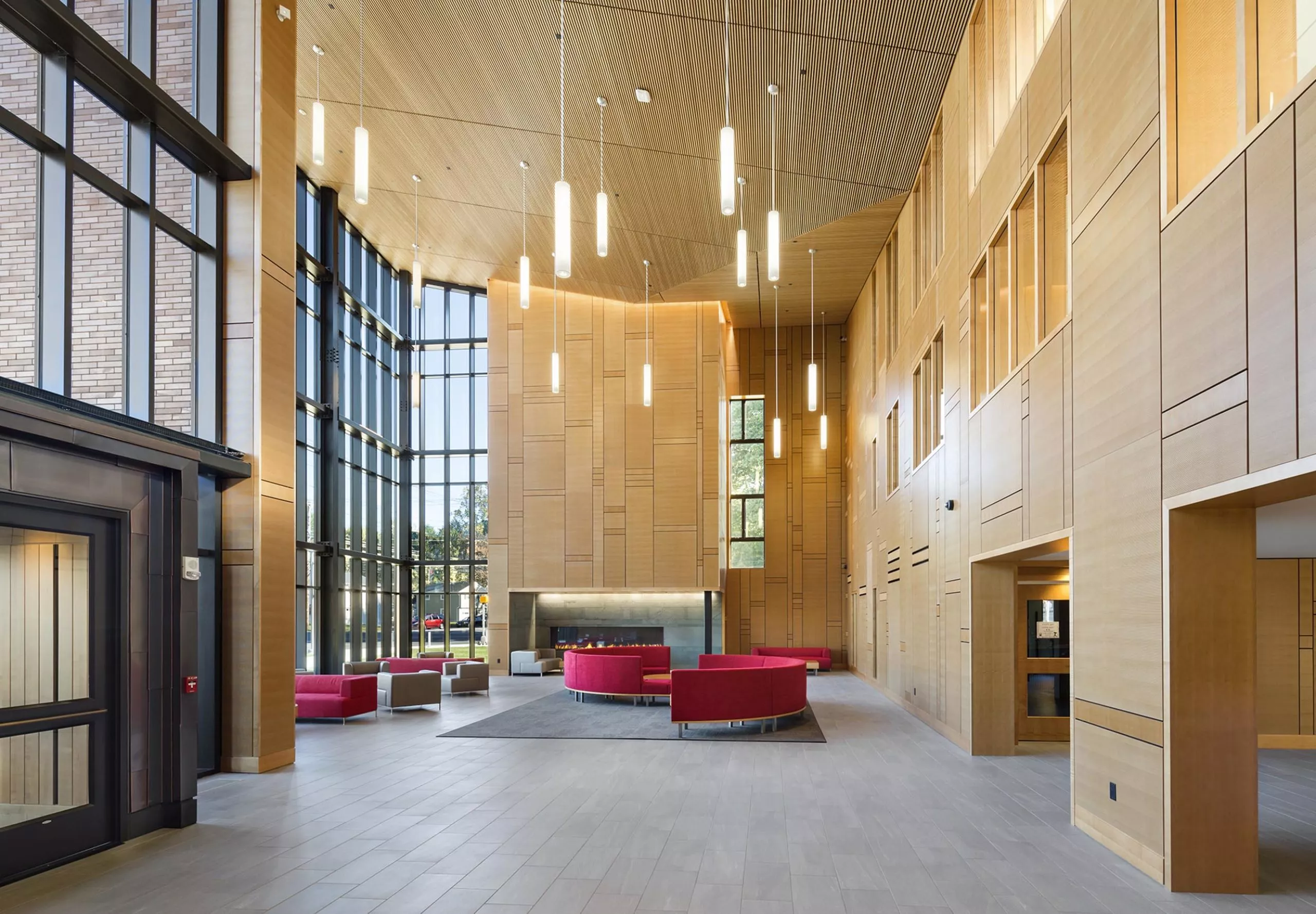 interior view of common area with couches and chairs at Sacred Heart University Jorge Bergoglio Hall