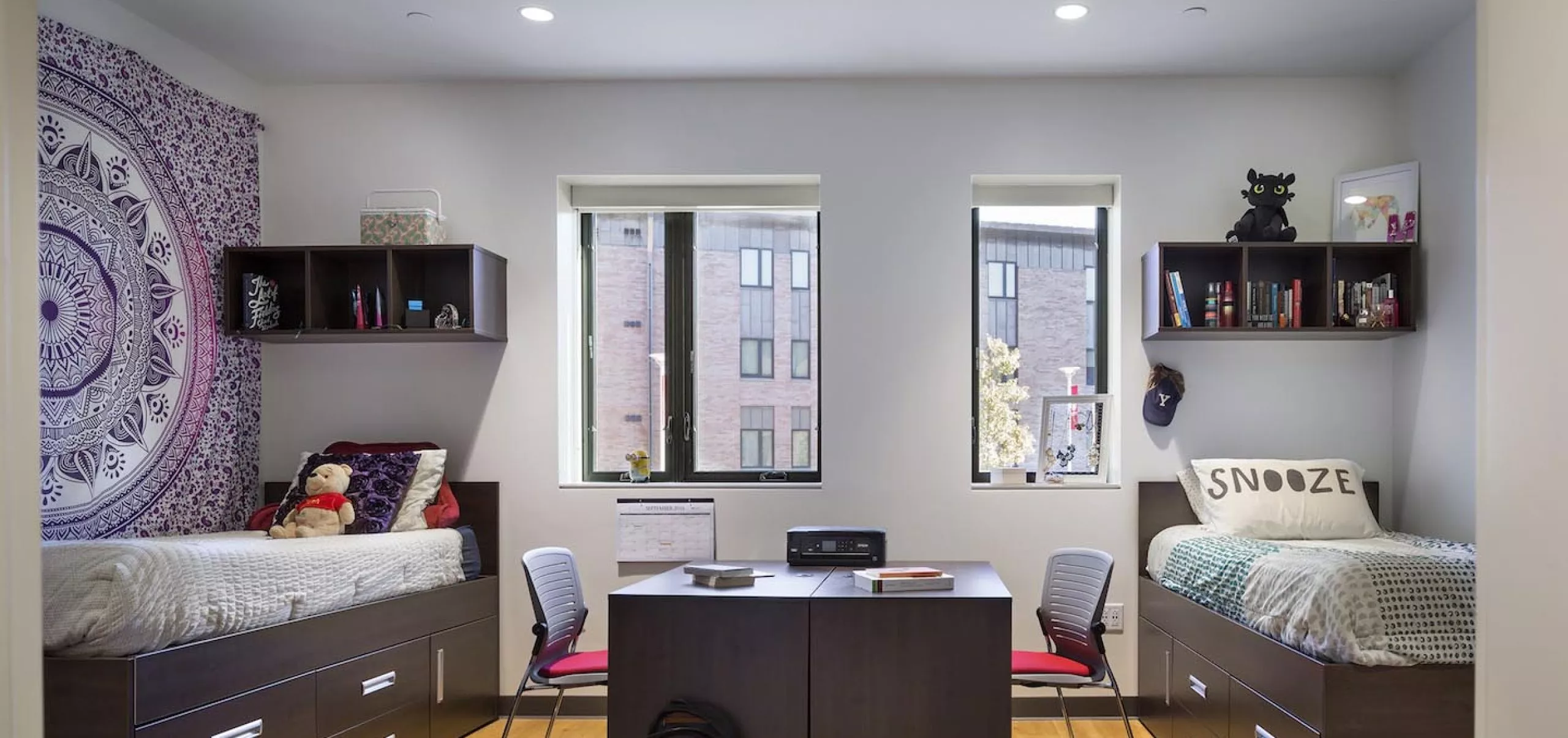 interior view of dorm room with two beds at Sacred Heart University Jorge Bergoglio Hall