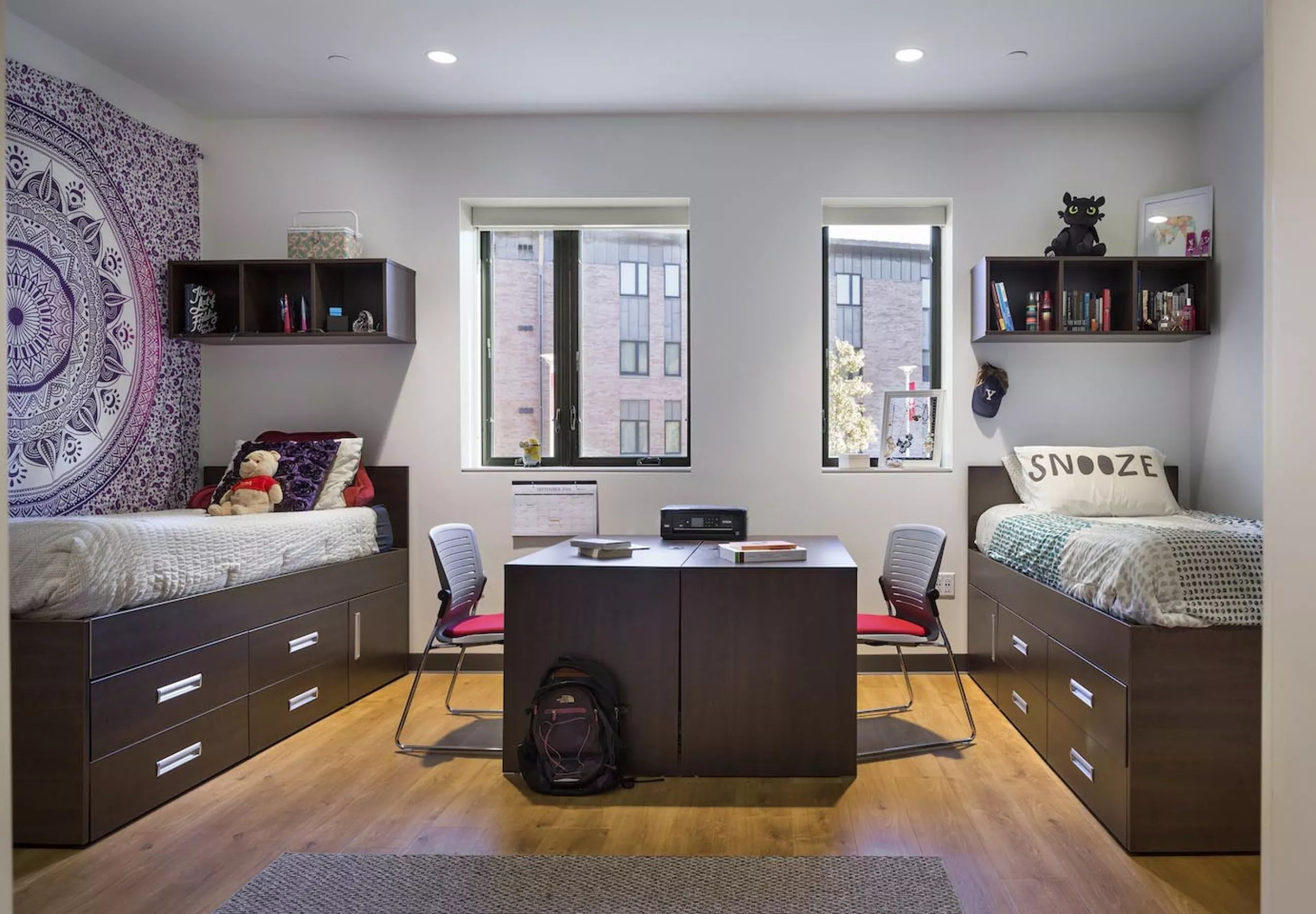 interior view of dorm room with two beds at Sacred Heart University Jorge Bergoglio Hall