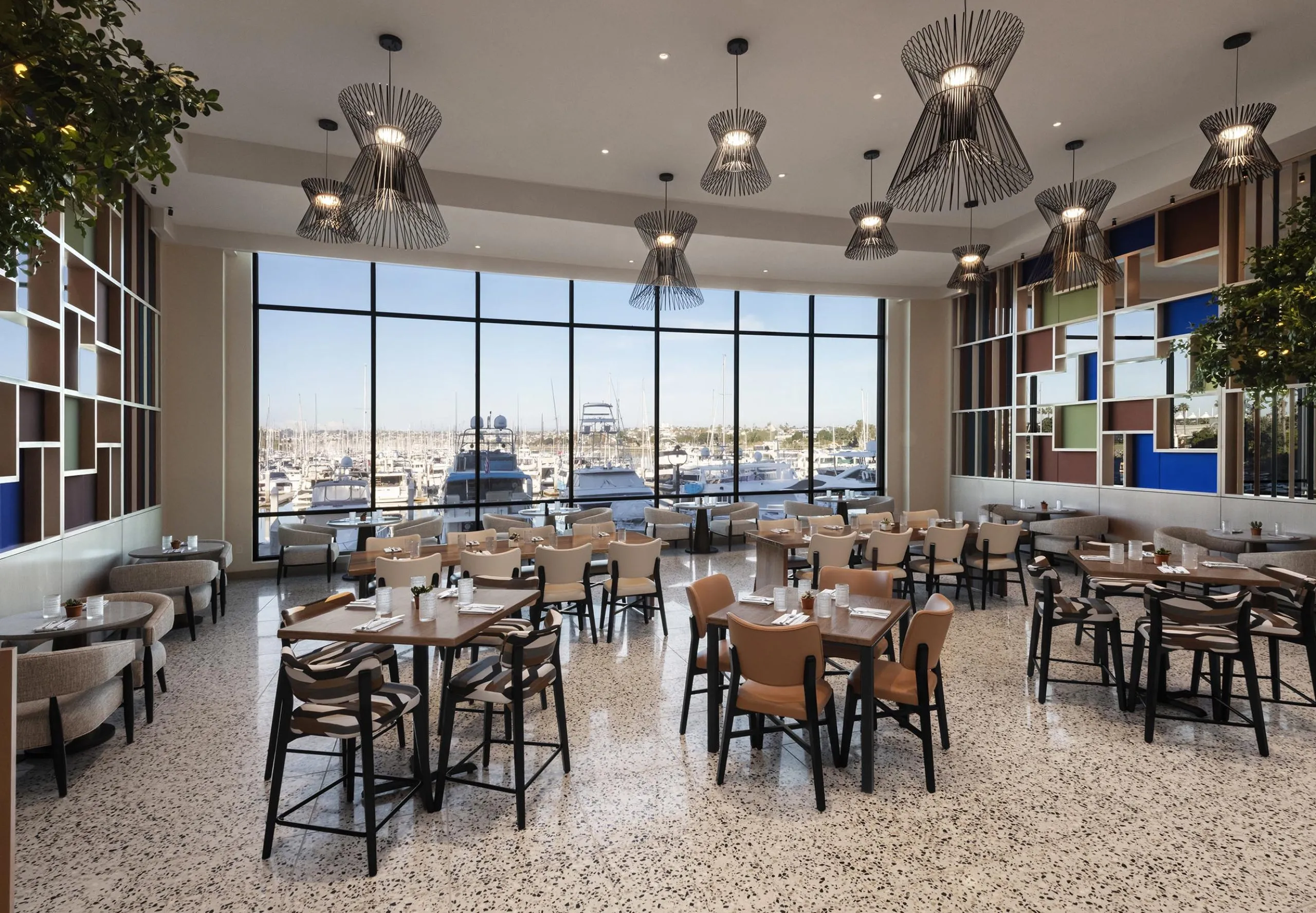 Interior view of the dining room and large window at the Sheraton San Diego Hotel