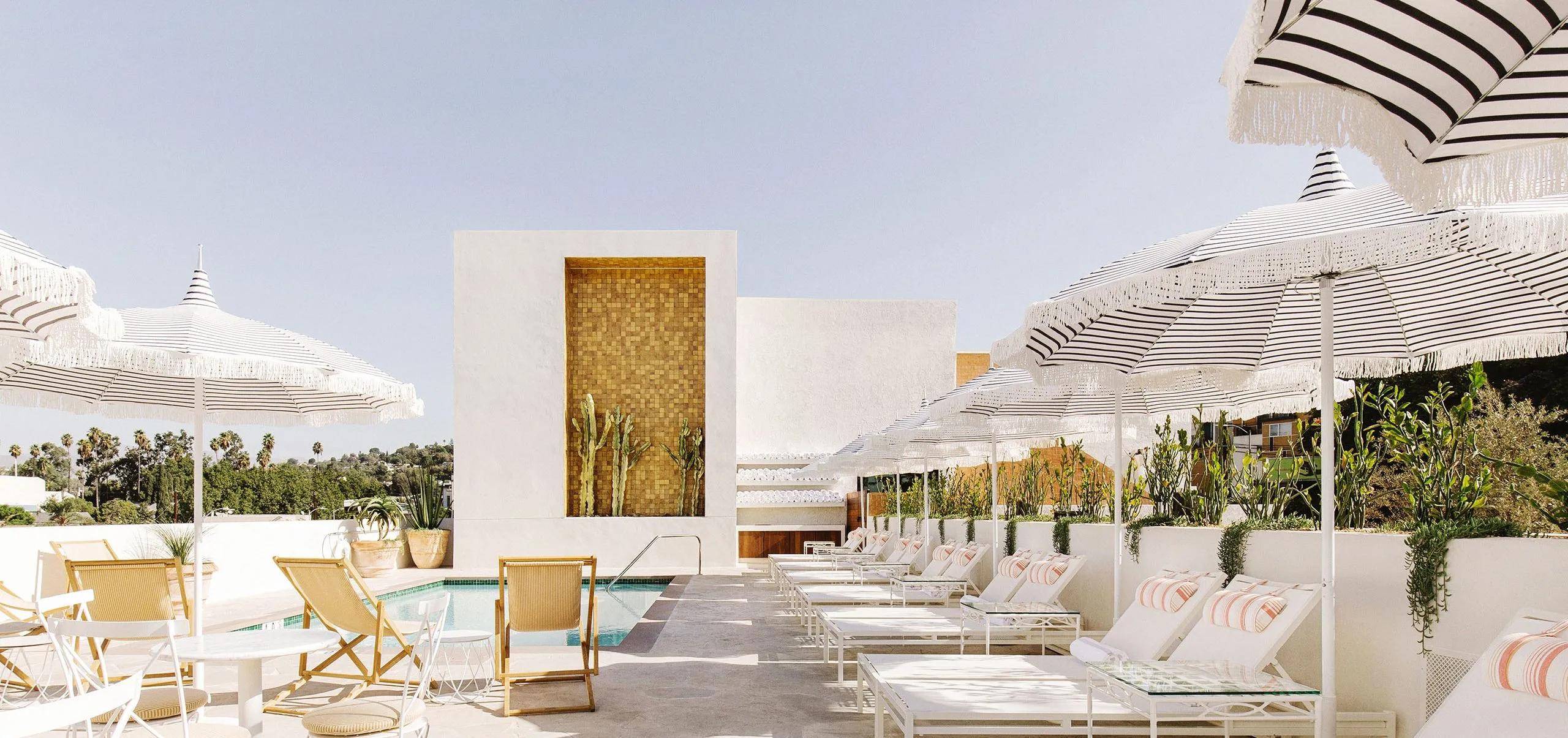 Exterior view of the pool and lounge chairs at the Silver Lake Pool Inn