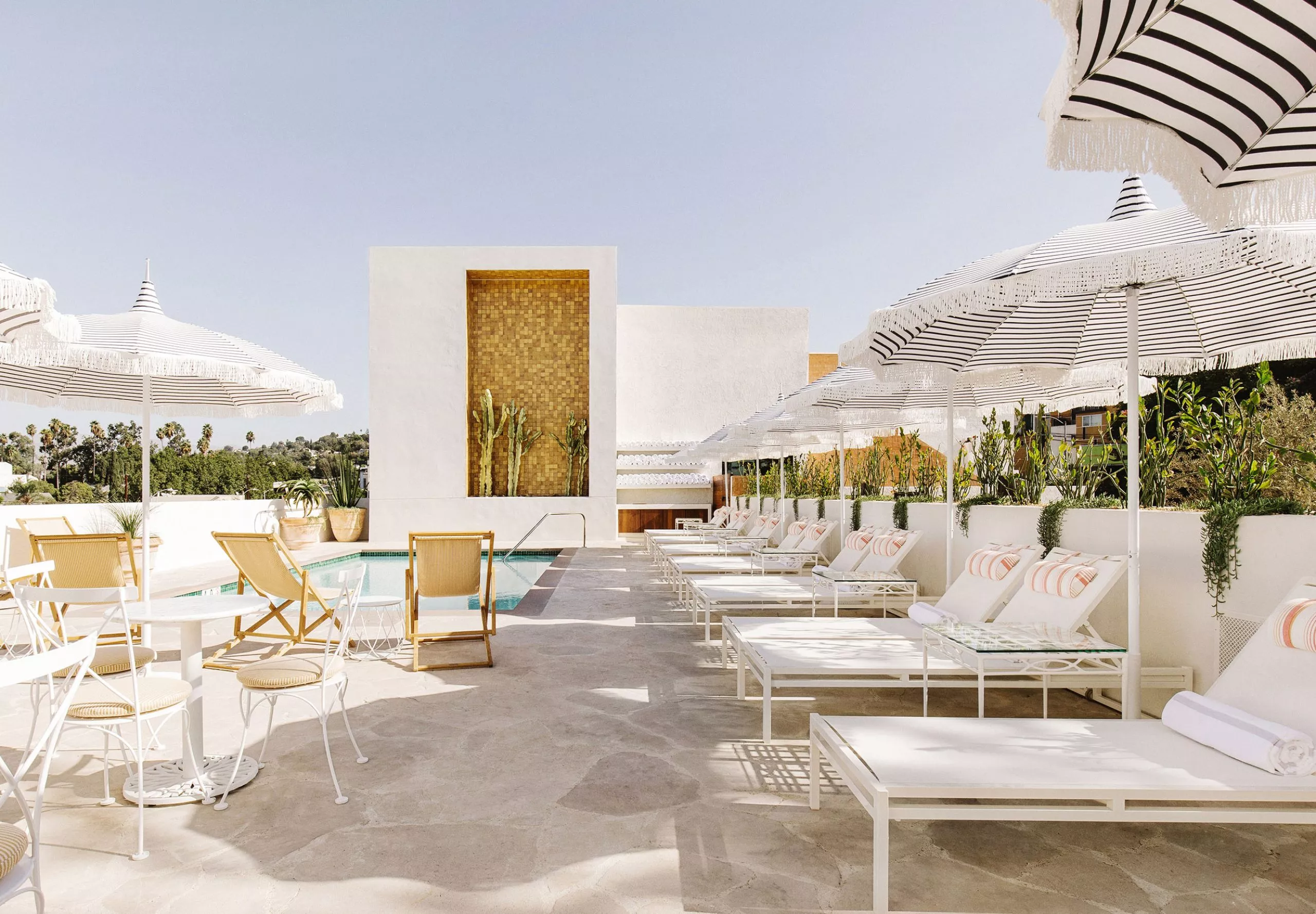 Exterior view of the pool and lounge chairs at the Silver Lake Pool Inn