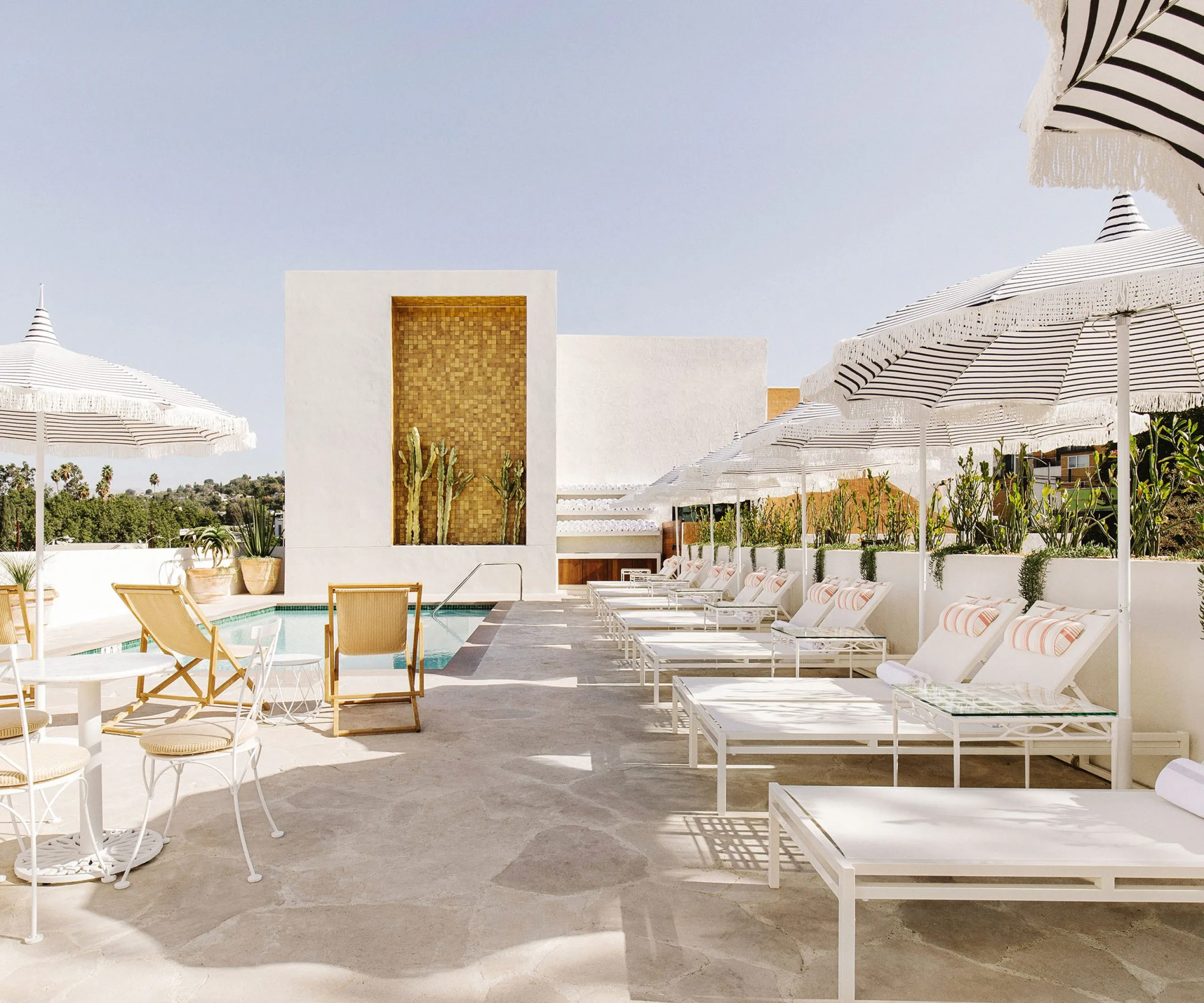 Exterior view of the pool and lounge chairs at the Silver Lake Pool Inn