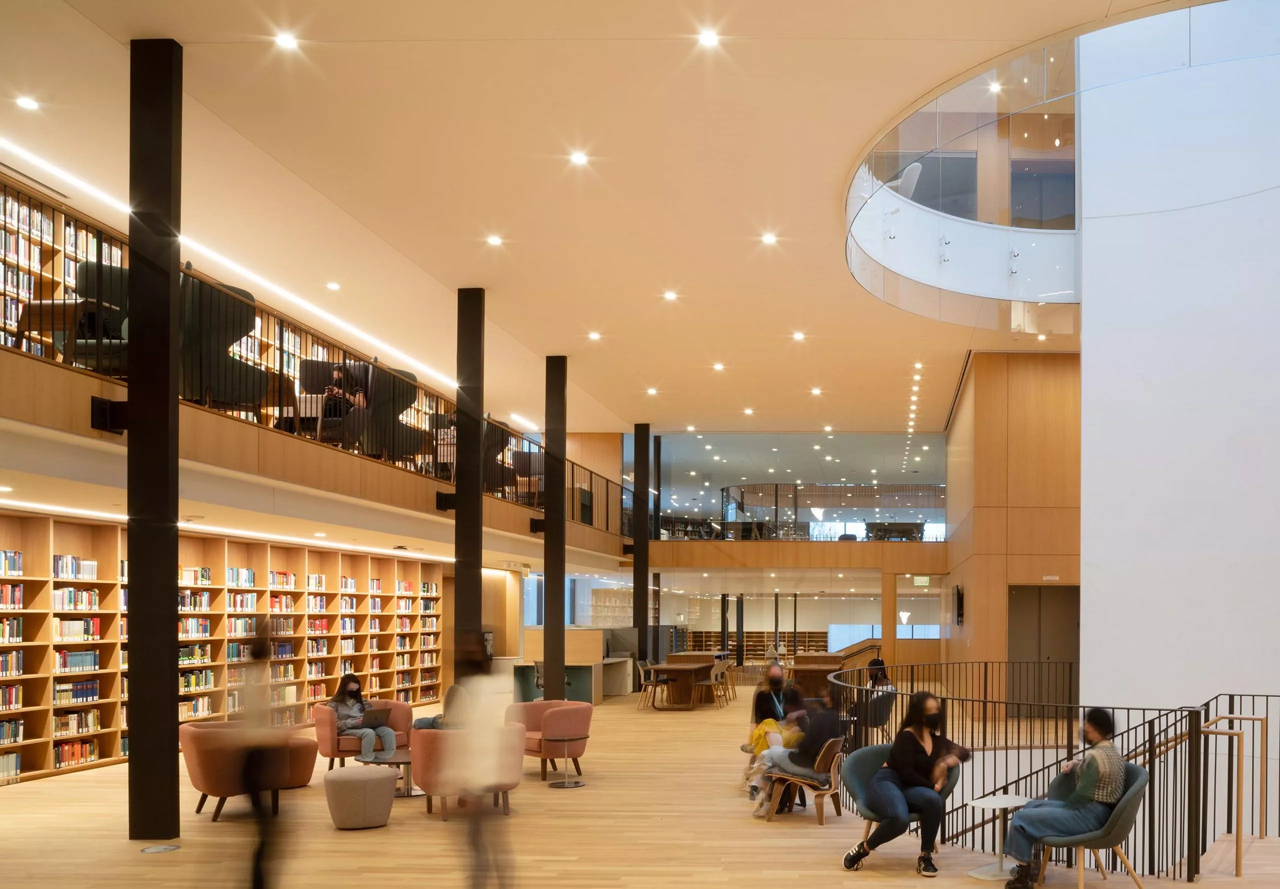 Sitting area and bookshelves inside Smith College Neilson Library