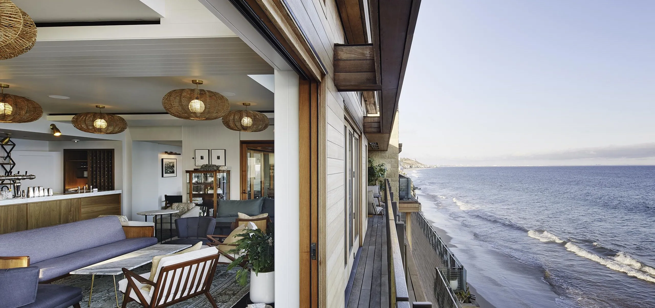 Interior view of lobby seating group overlooking the ocean at the Soho Little Beach House