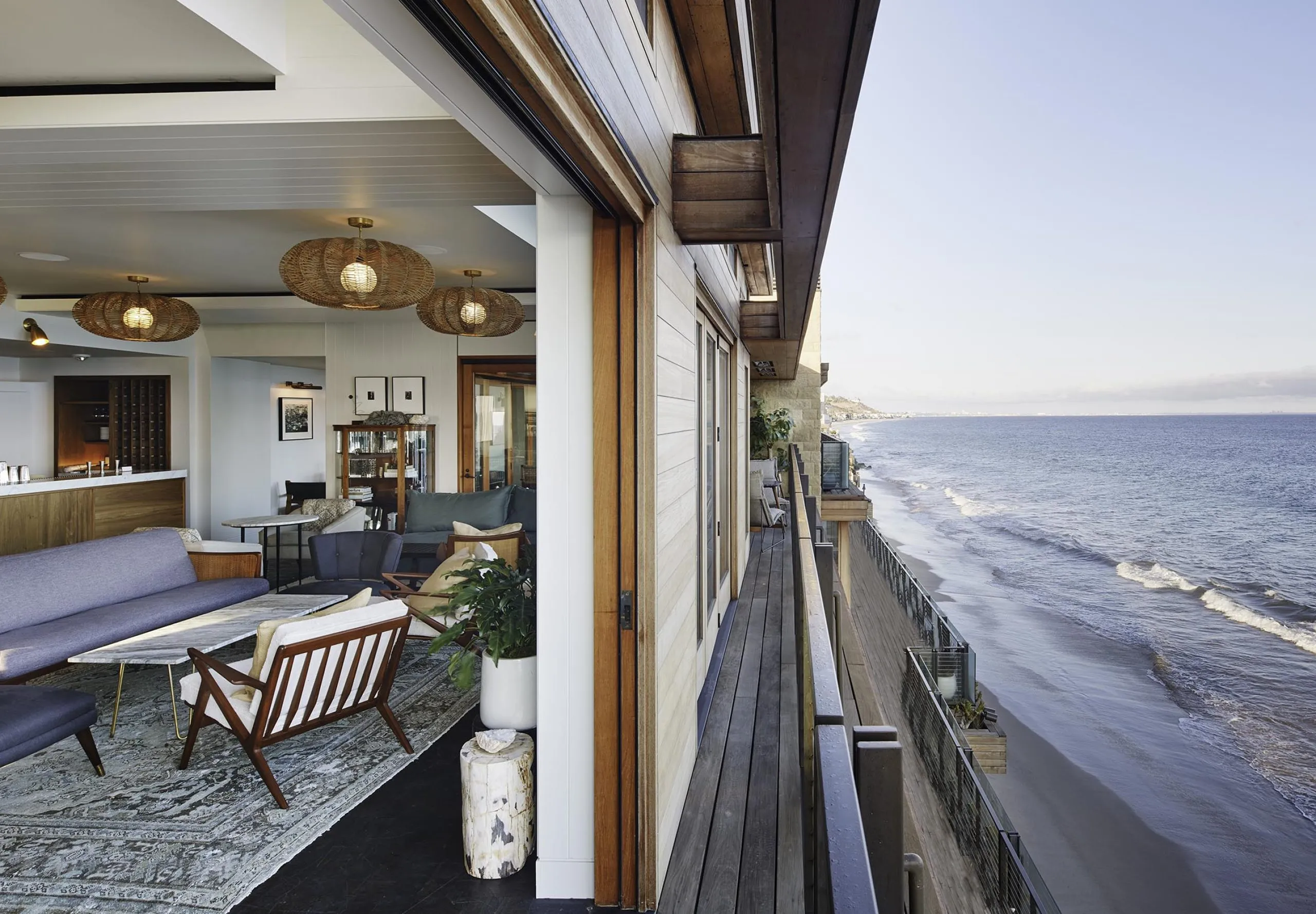 Interior view of lobby seating group overlooking the ocean at the Soho Little Beach House