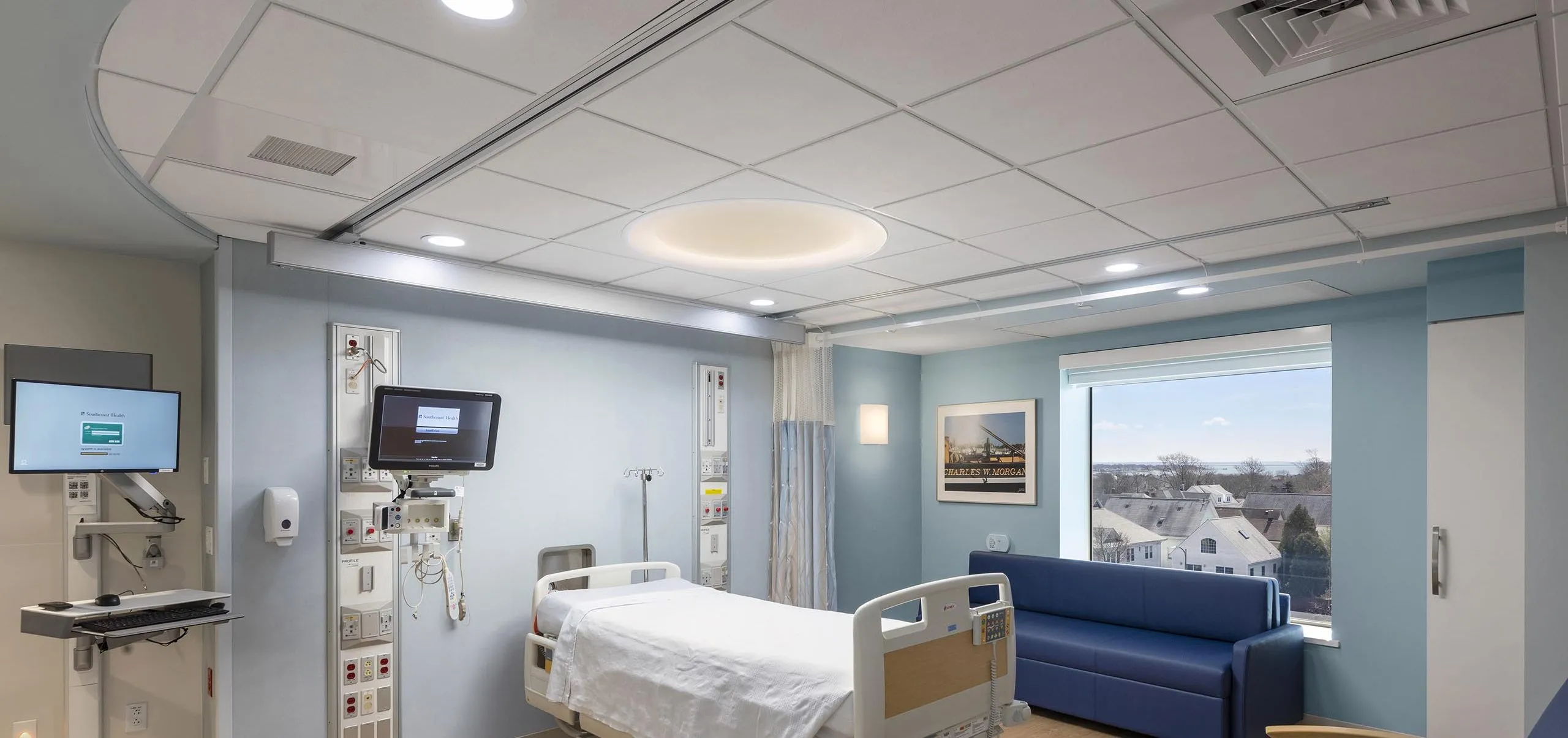 Interior view of a hospital room with a blue couch and chair at St. Luke's Hospital