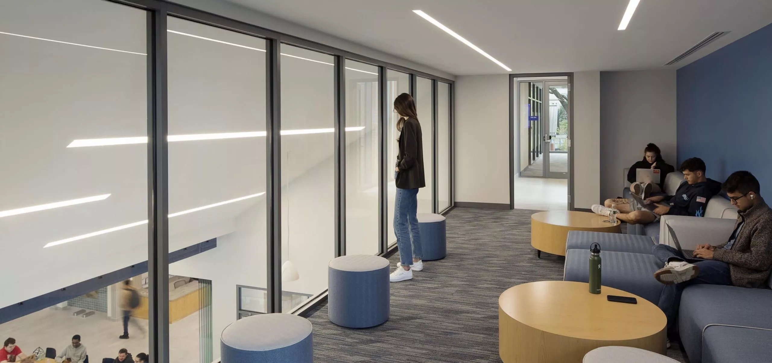 Students working in lounge area in Southern Connecticut State University School of Business